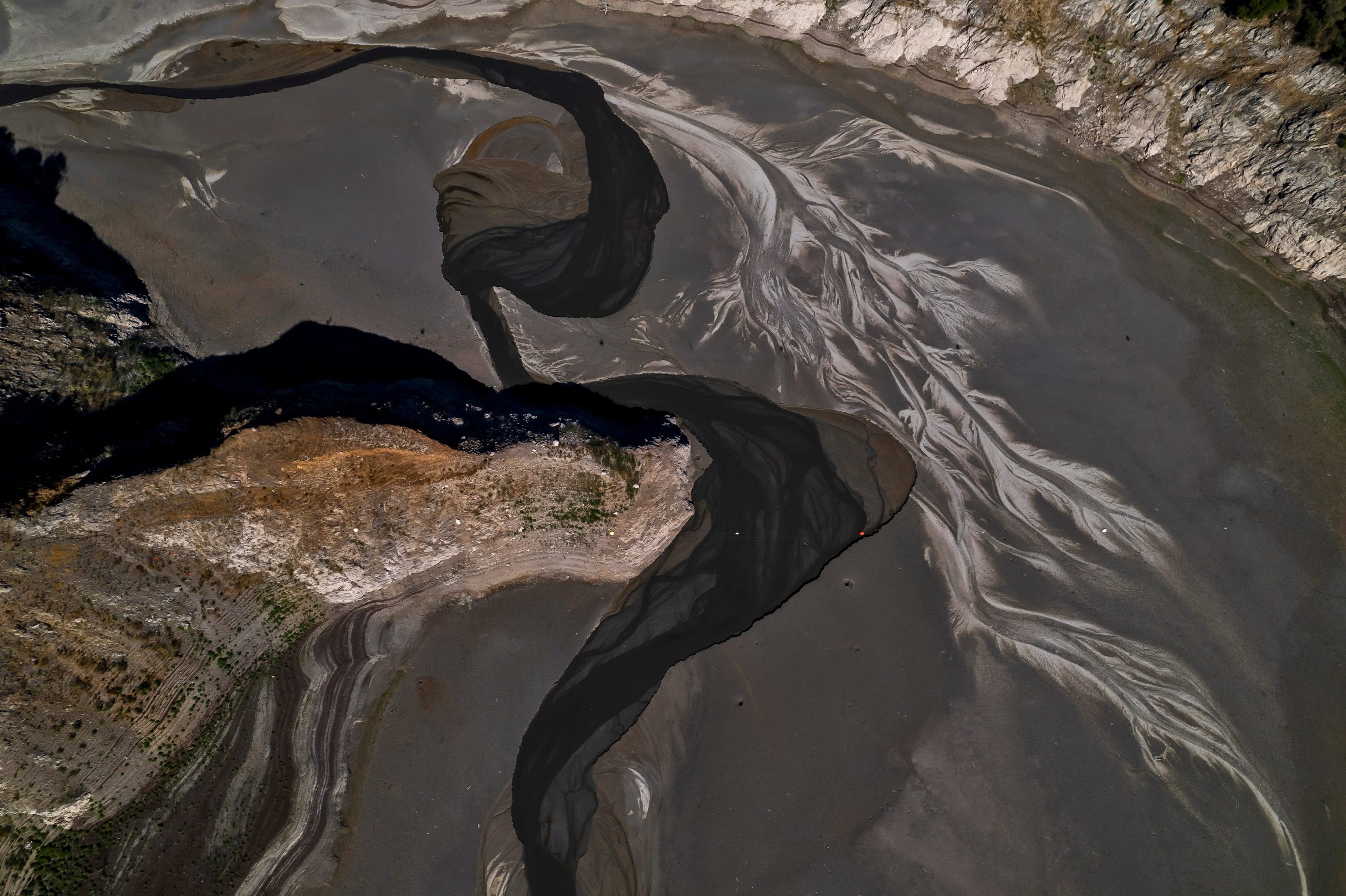 An aerial view of the reservoir shows a swirl of patterns.