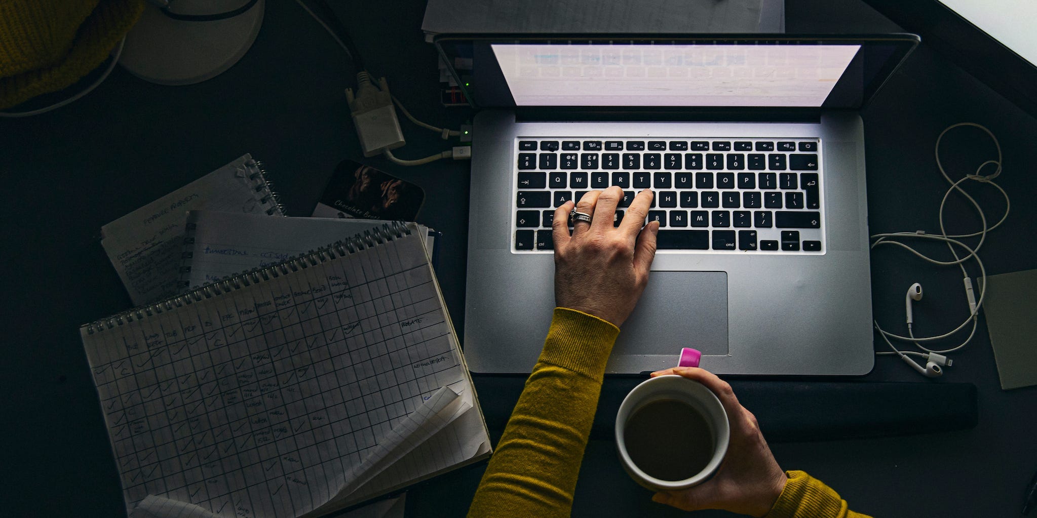 professional using laptop at night working with documents