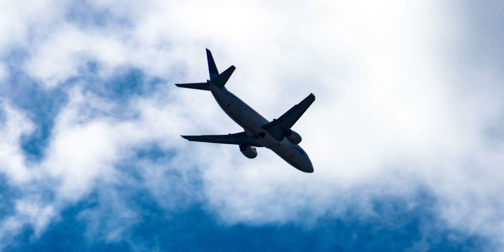 Silhouette of Boeing B737 specifically 737-400 Cargo freight aircraft as seen against the sun during final approach for landing at Thessaloniki SKG LGTS Macedonia International airport in Greece on 1st June 2020.