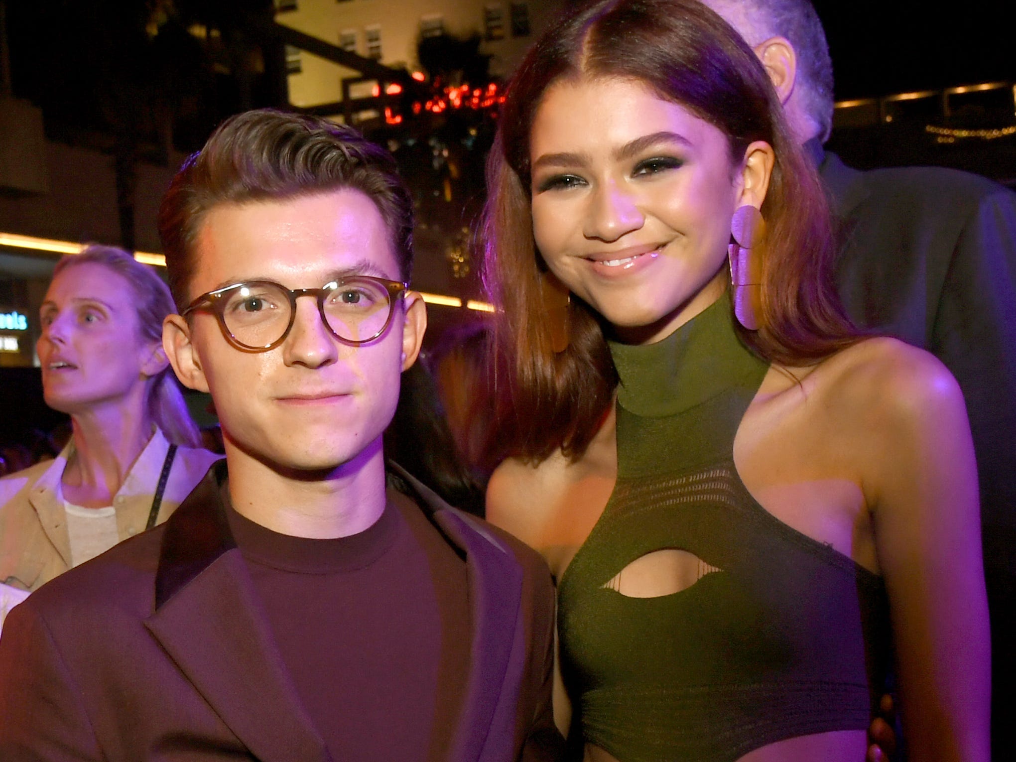 Tom Holland and Zendaya were photographed kissing in a car after long