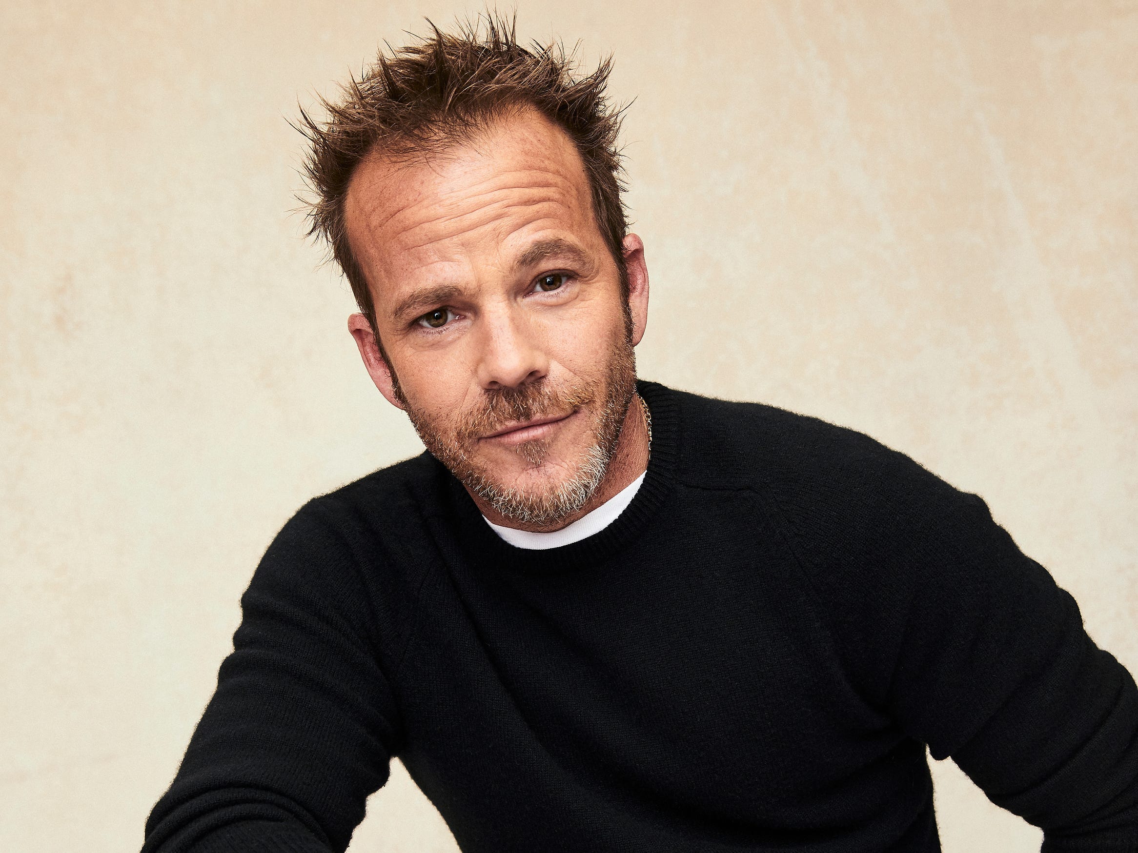 Stephen Dorff sitting on a white square