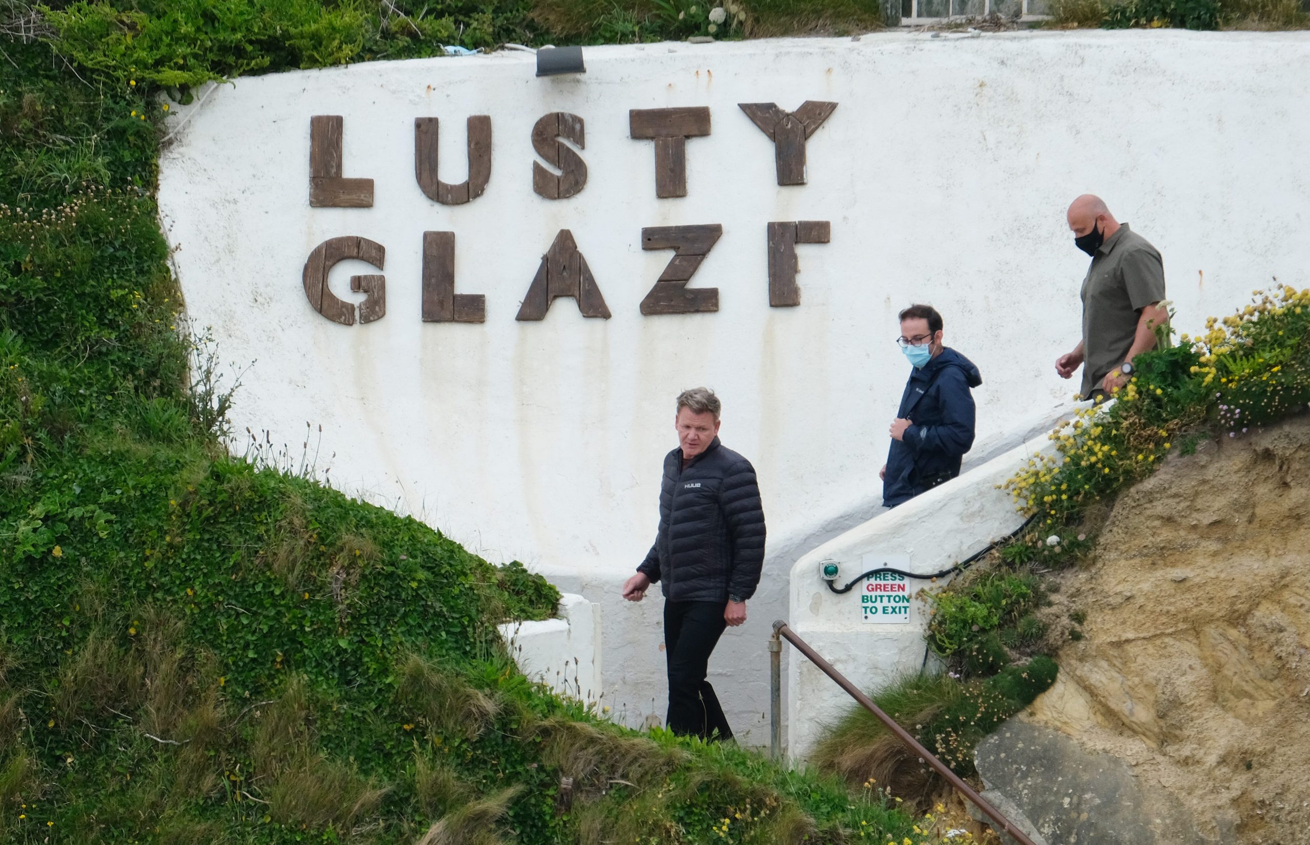 Gordon Ramsay entering Lusty Glaze Beach in Newquay, Cornwall.
