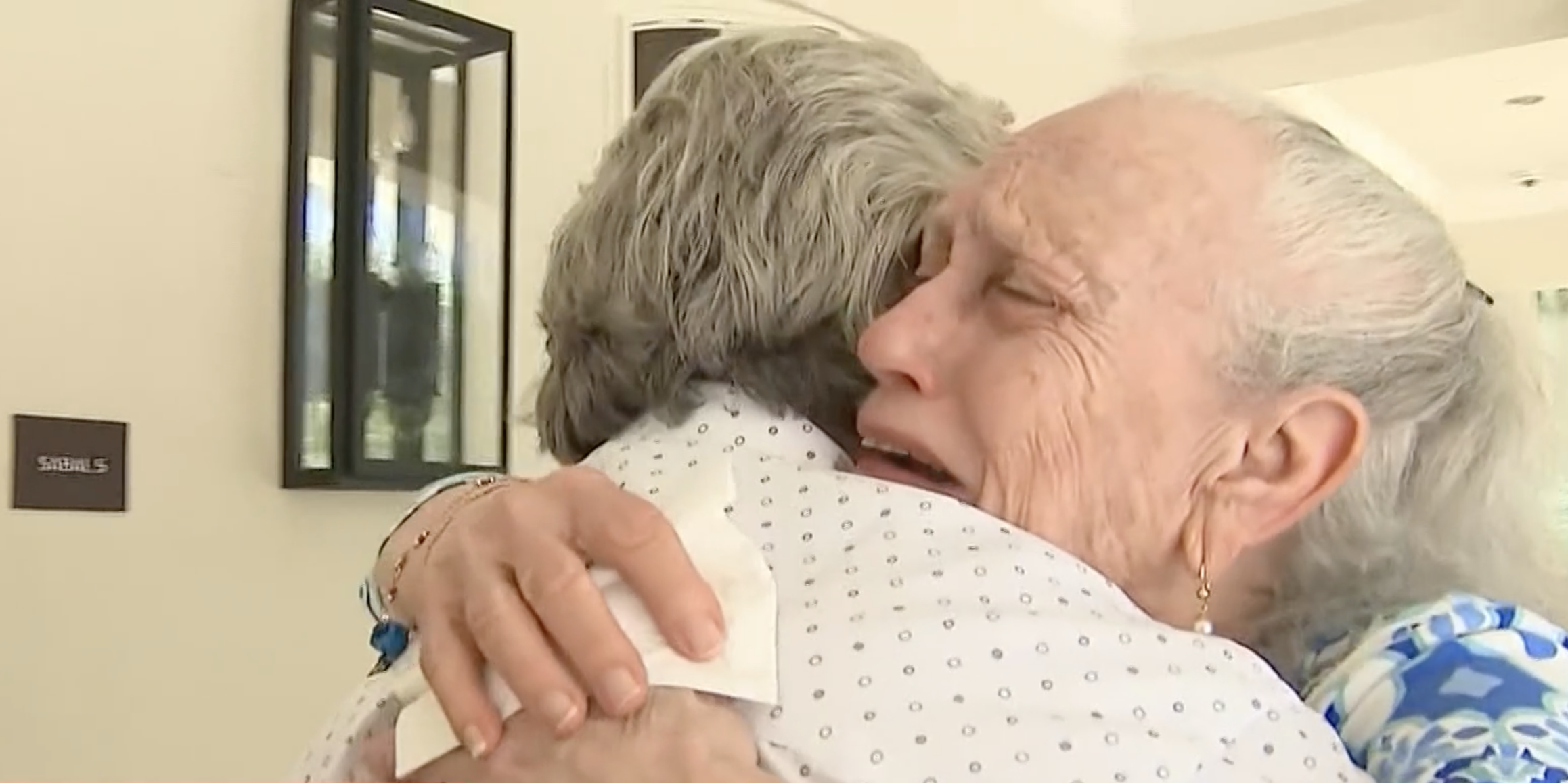 Esther Gorkinfel wraps her arms around Alfredo Lopez, the man who rescued her from the Champlain Towers condominium, in their first meeting after their escape.