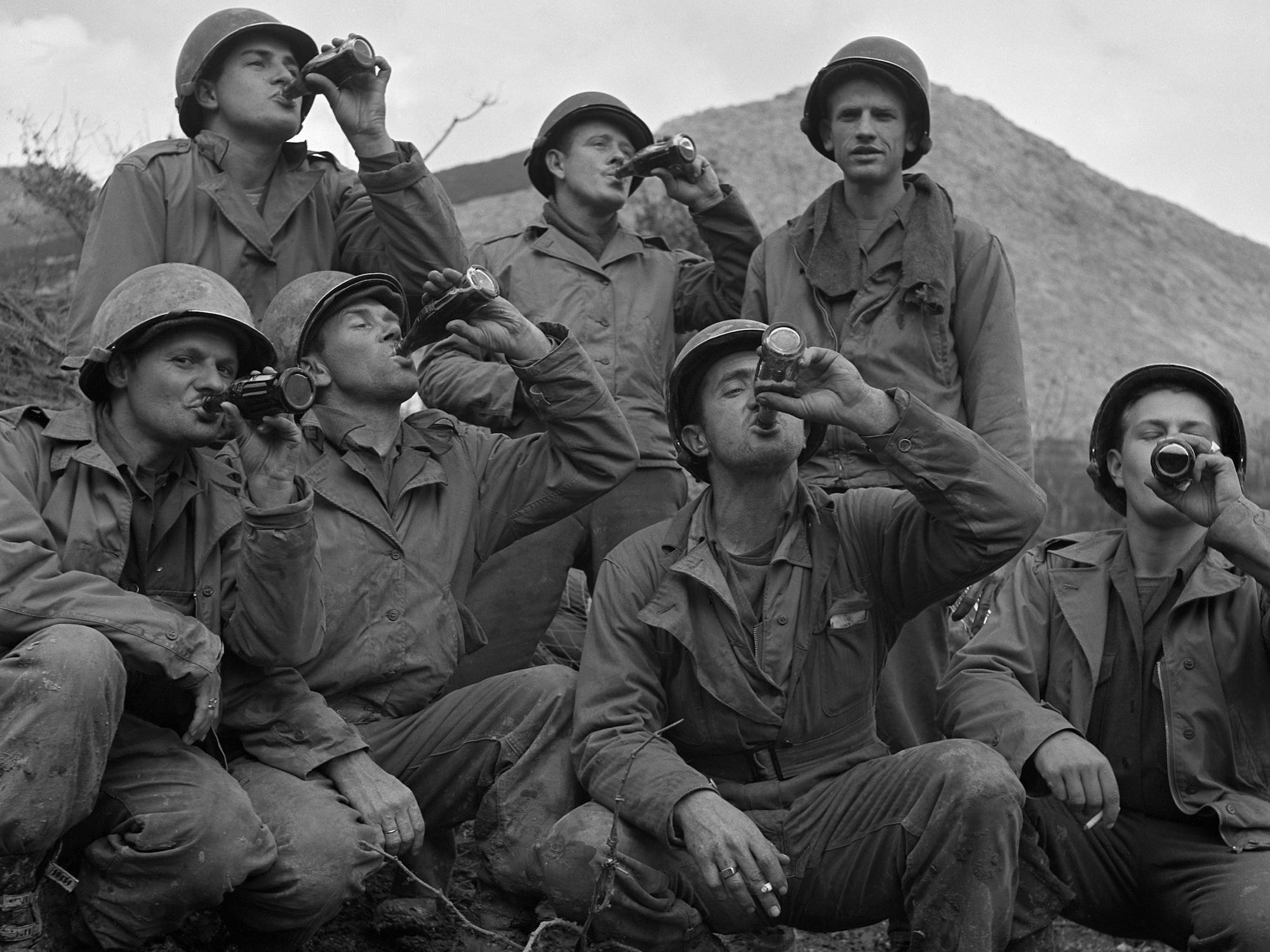 US soldiers drinking Coca Cola in Italy during WWII
