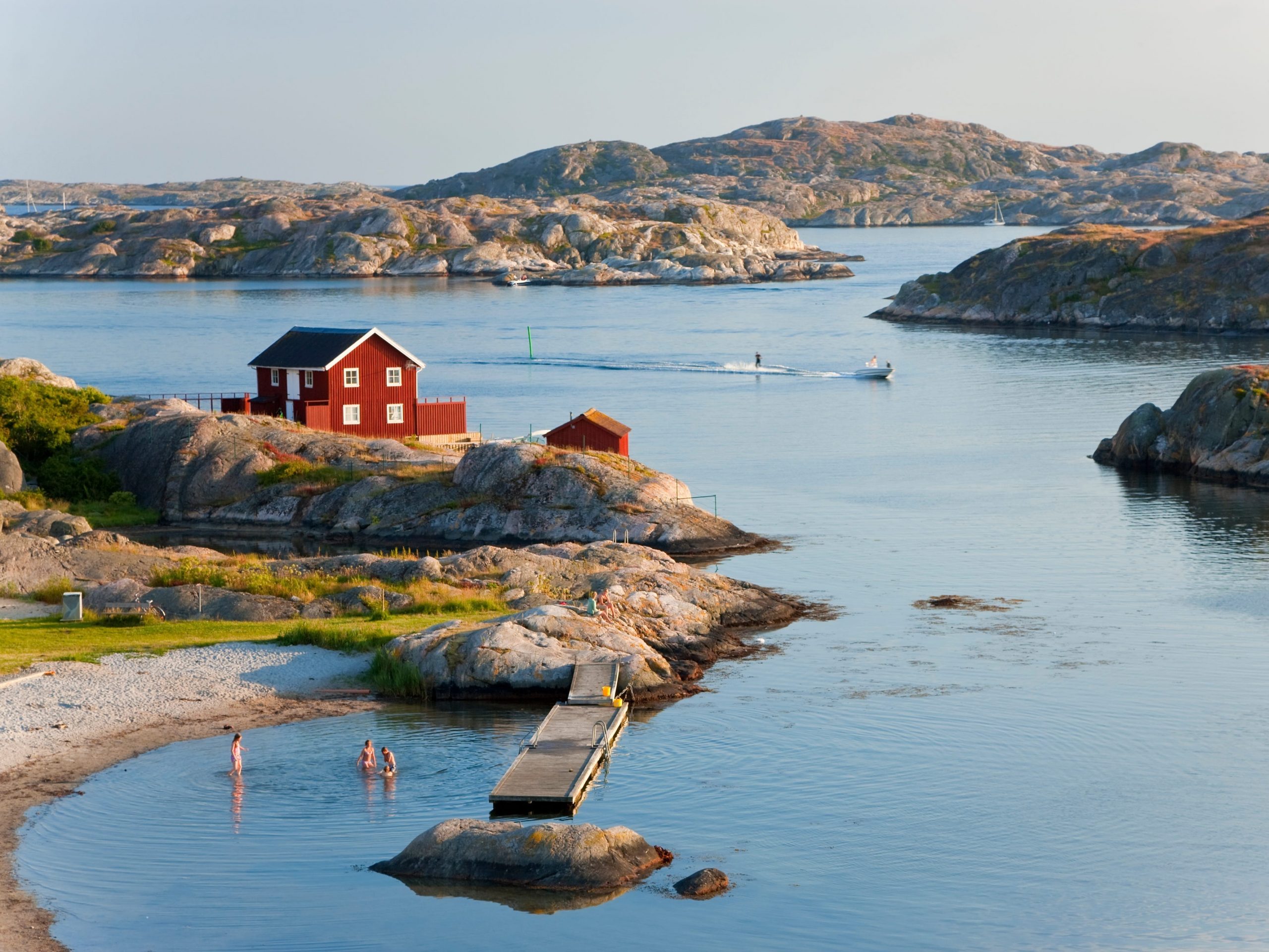 People bathing in the sea in, Tjorn, Sweden.