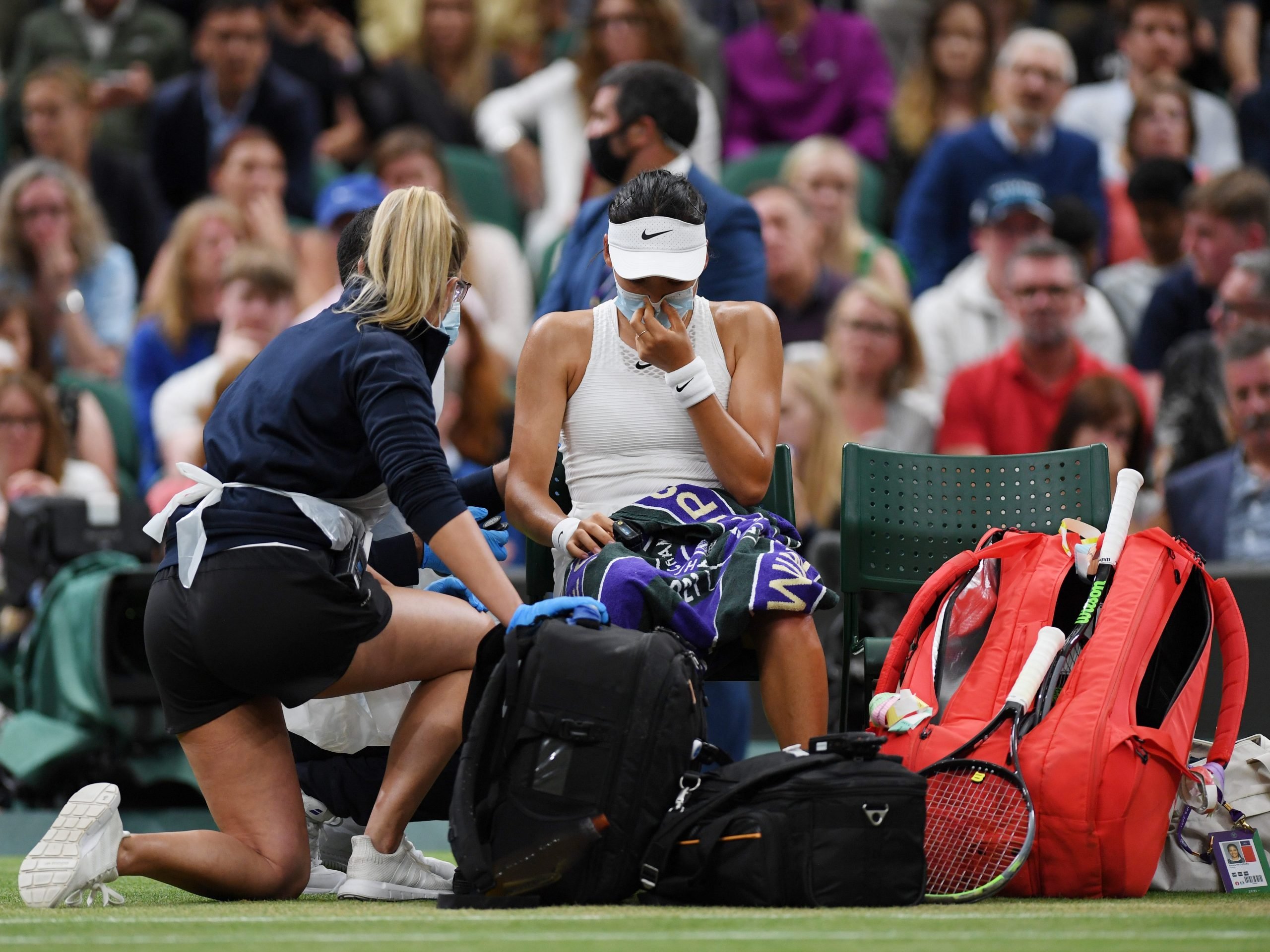 Emma Raducanu of Great Britain receives medical treatment in her Ladies' Singles Fourth Round match against Ajla Tomljanovic