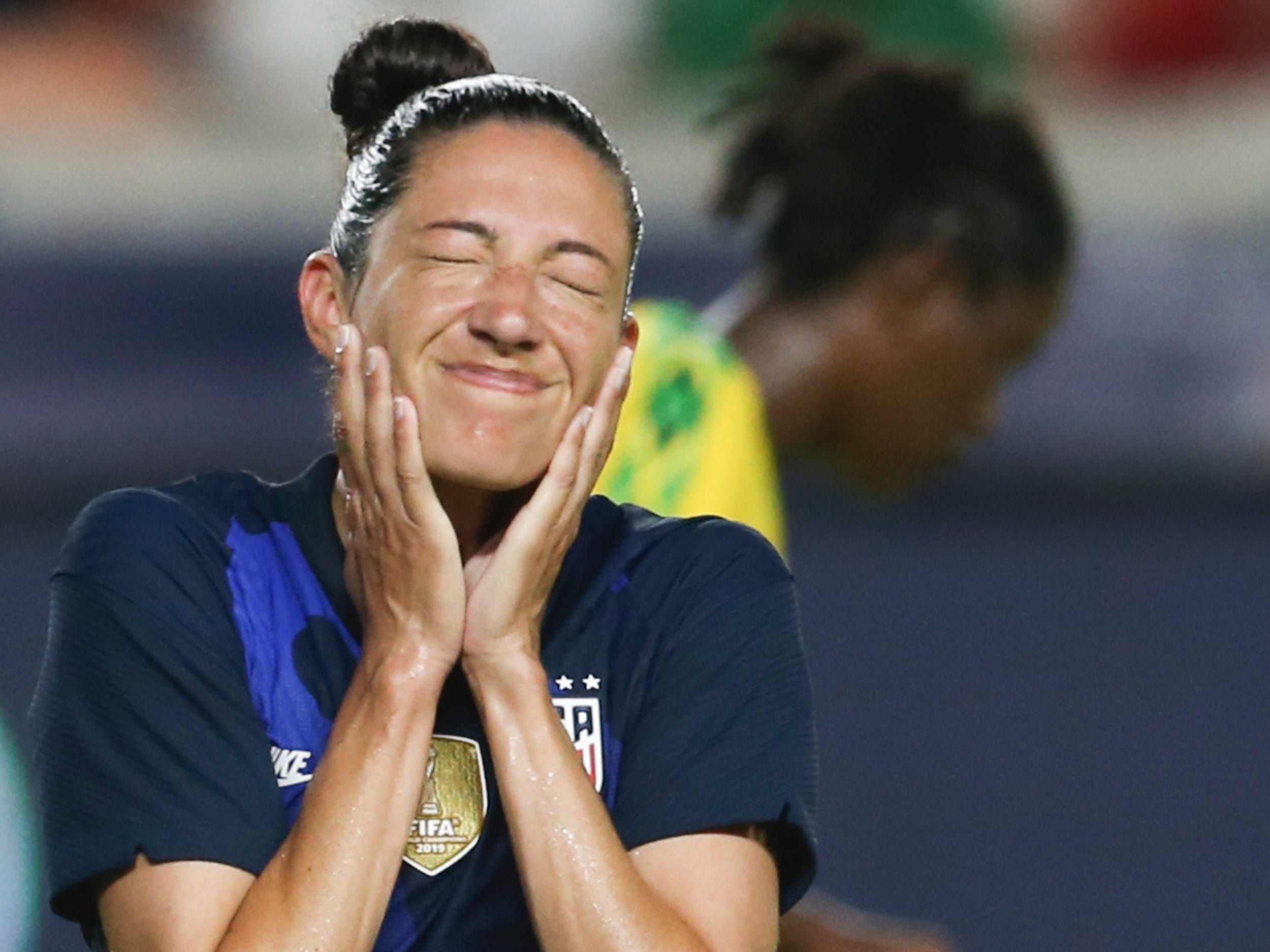 Christen Press grimaces.