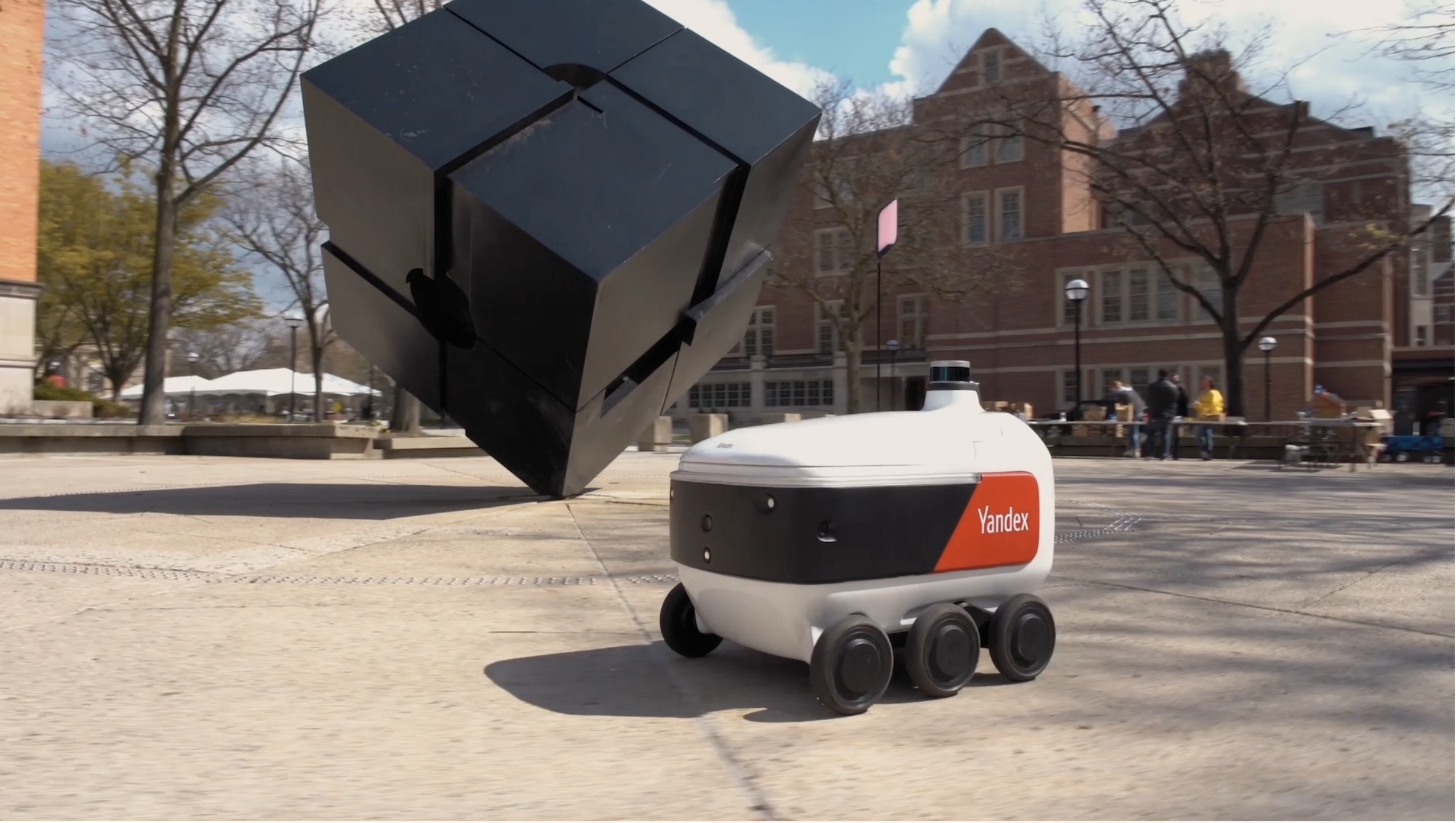 Picture of Grubhub and Yandex's new six-wheeled autonomous robot driving on the pavement