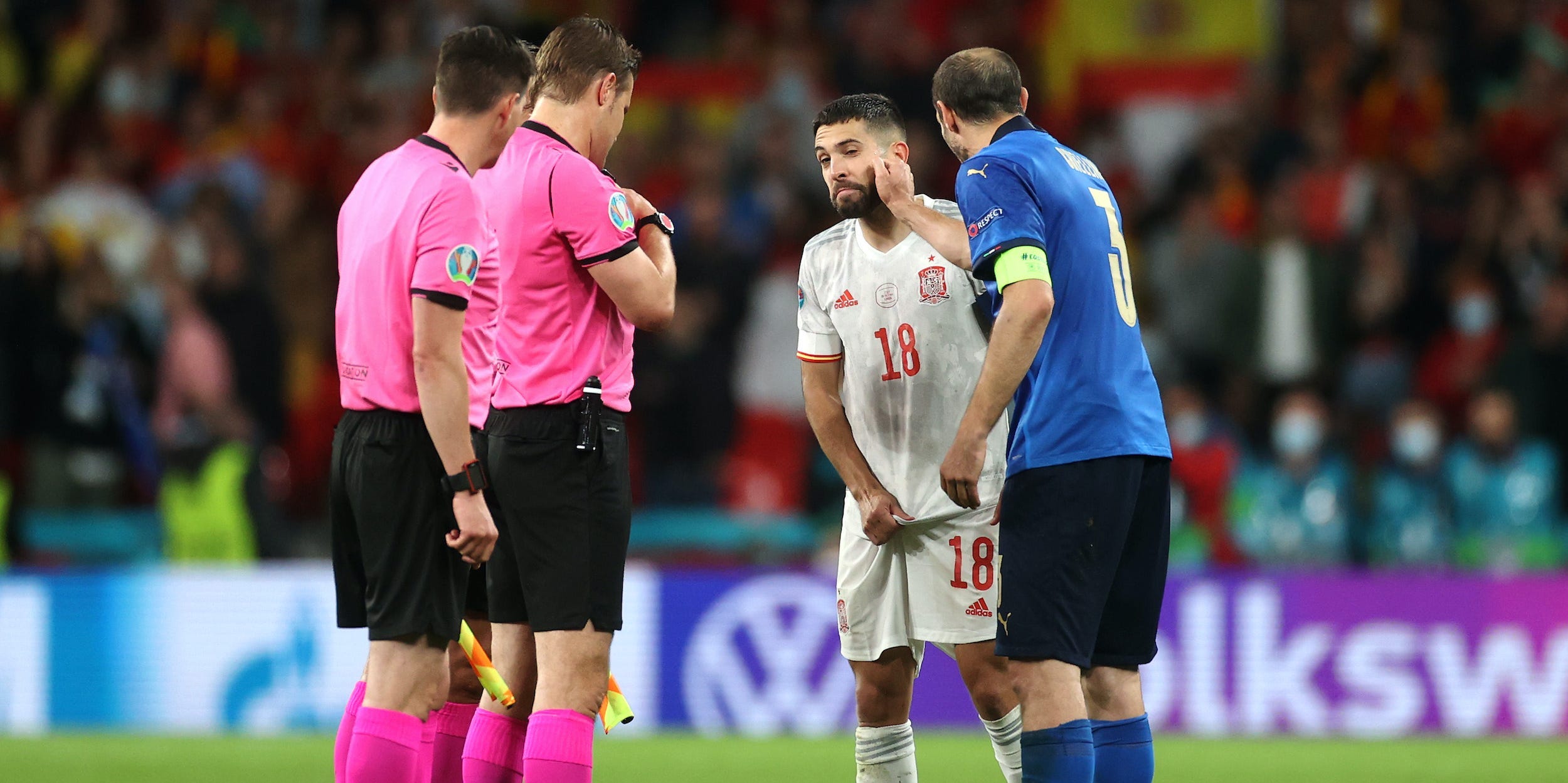 Italy's Giorgio Chiellini psyches out Spain's Jordi Alba ahead of the teams' Euro 2020 semifinal penalty shootout