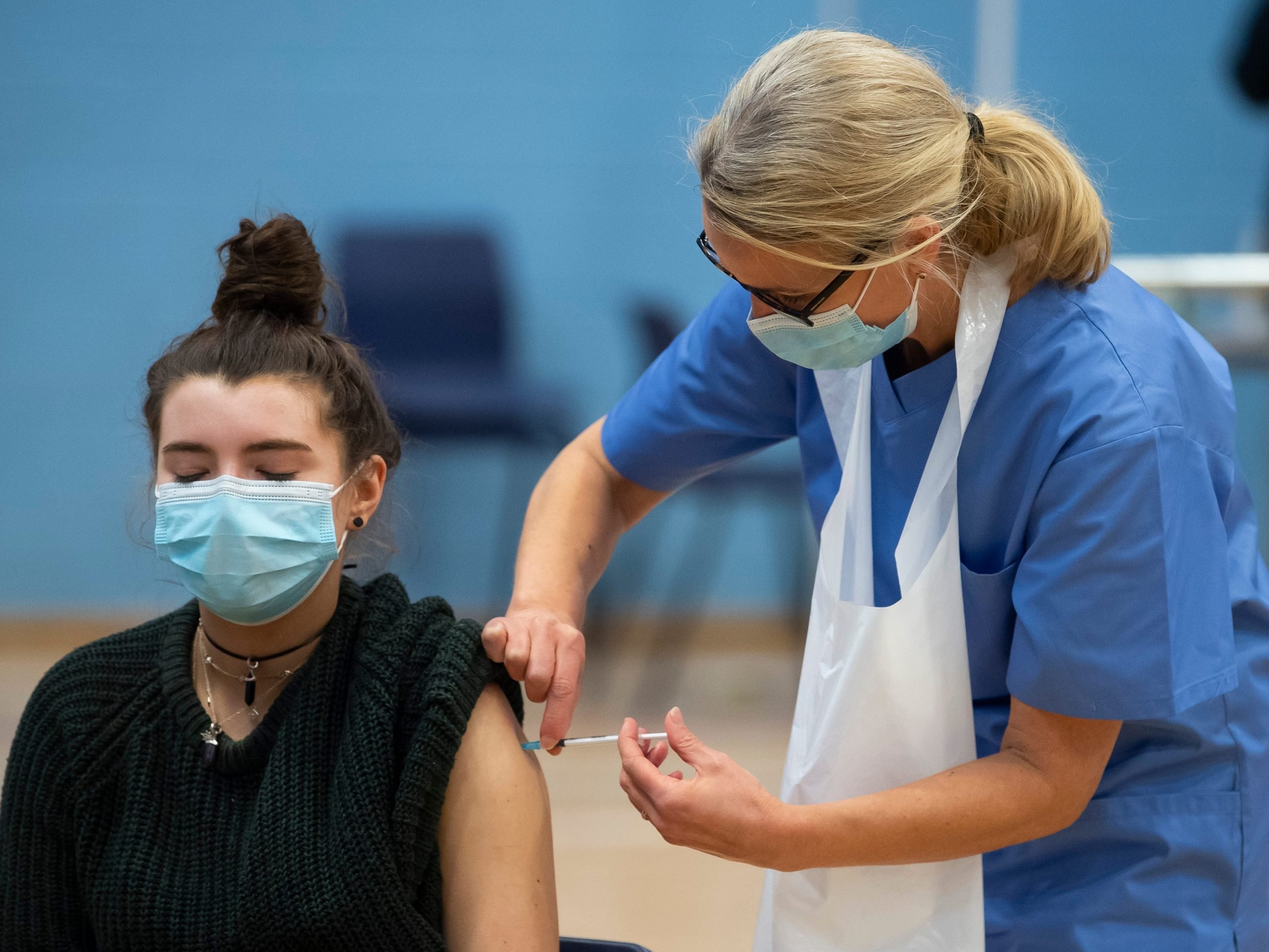 woman receiving covid vaccine