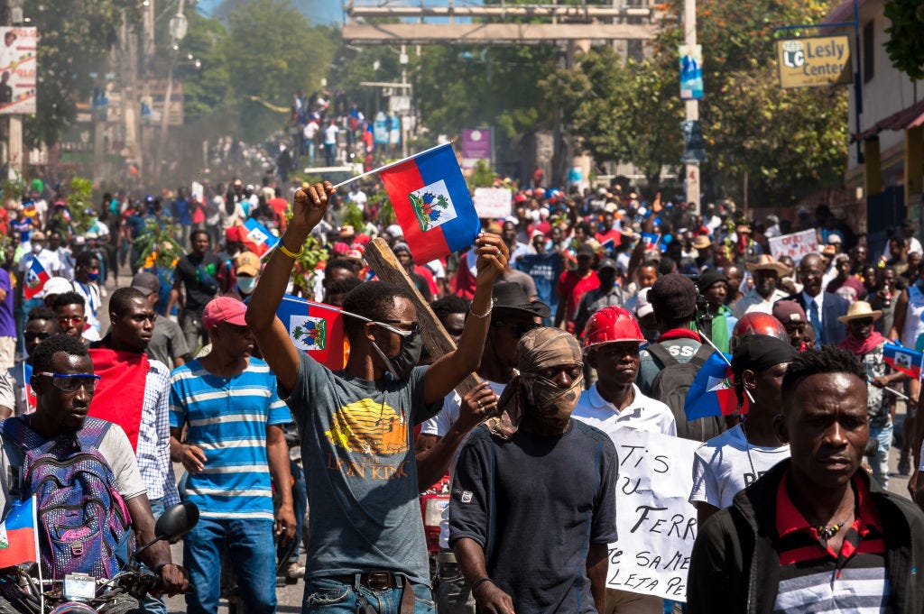Haitians demonstrate during a protest to denounce the draft constitutional referendum carried by the President Jovenel Moise on March 28, 2021 in Port-au-Prince, Haiti