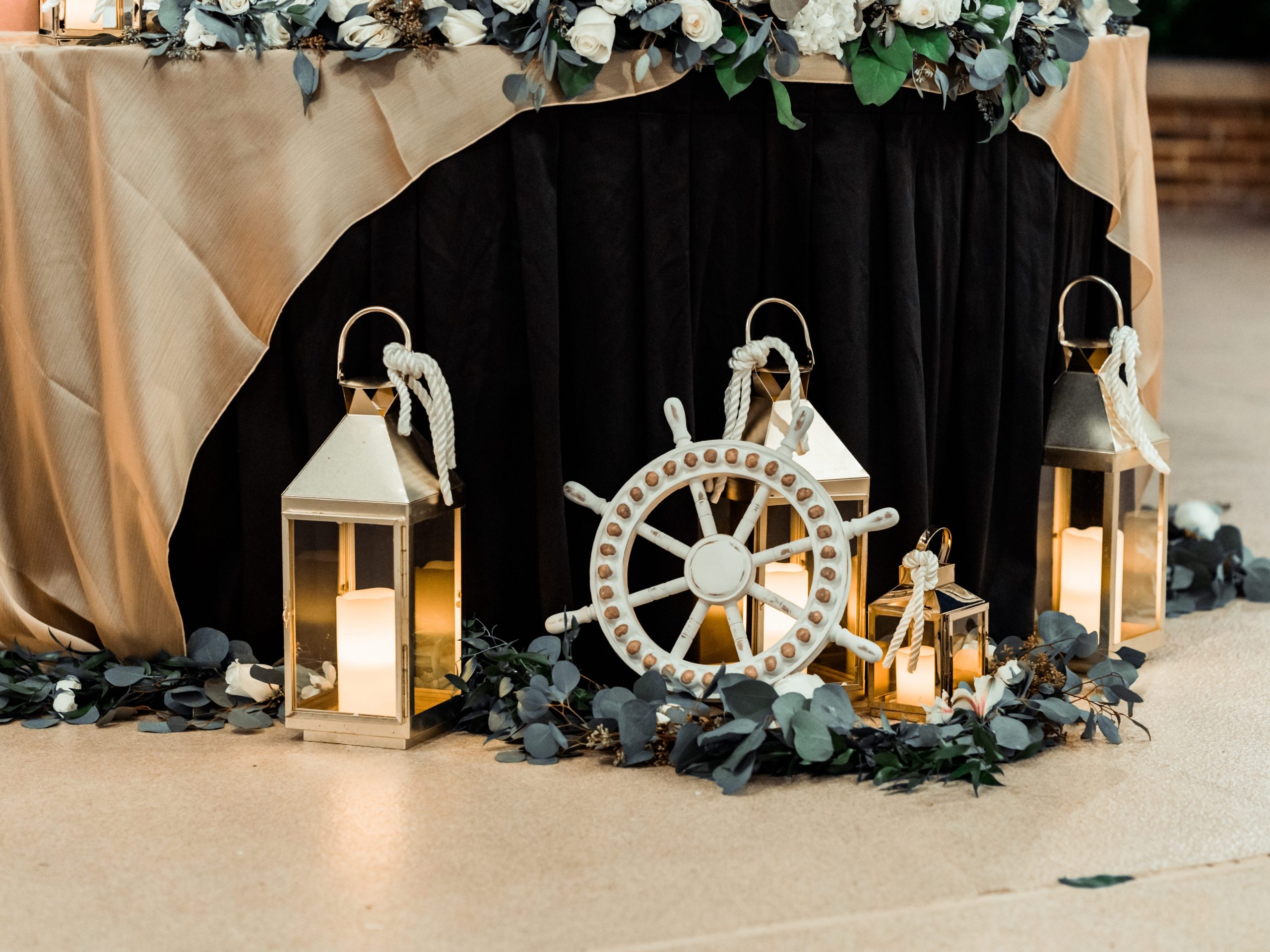 Lanterns and a ship wheel decor