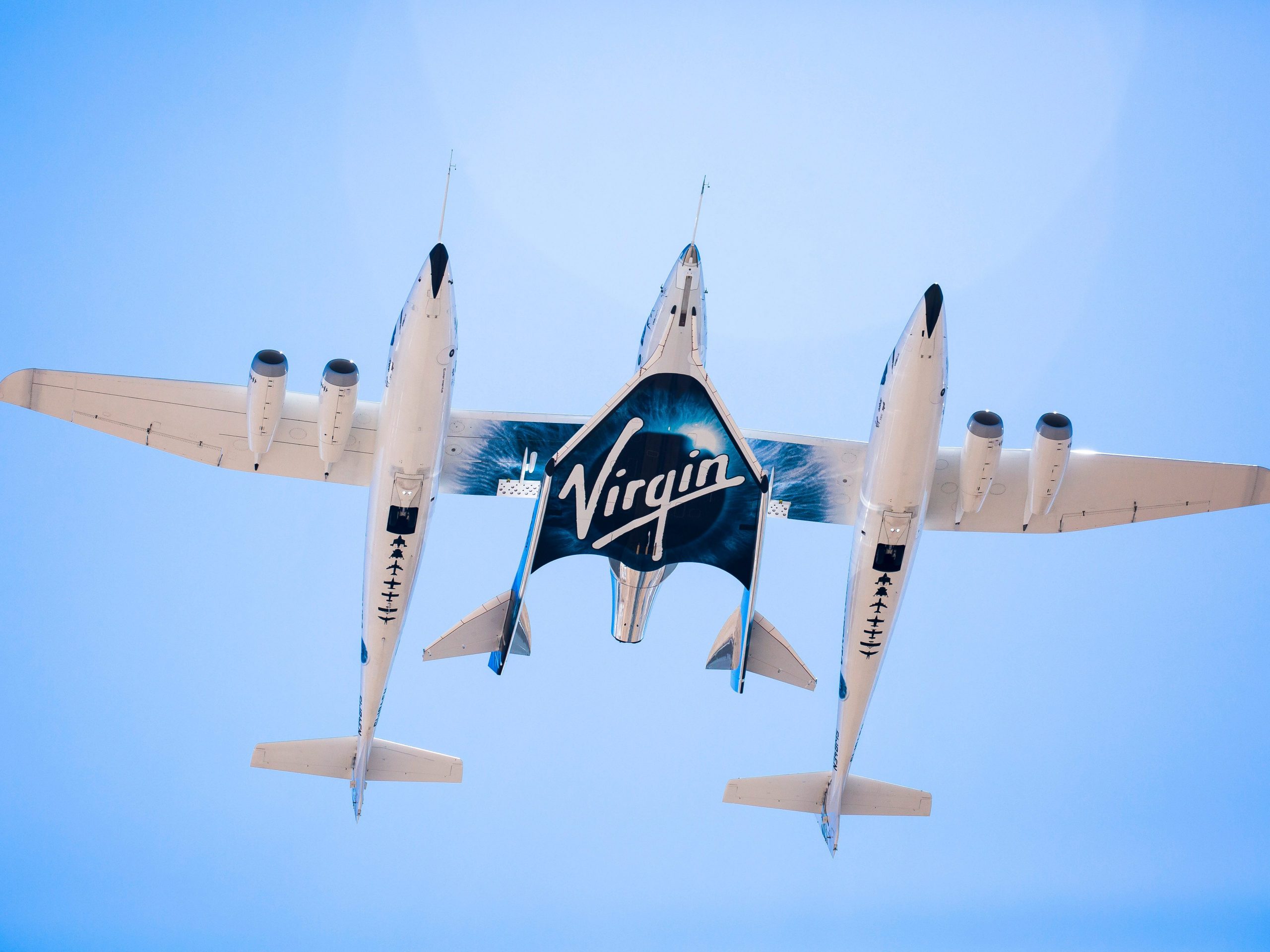 vms eve mothership double-body plane carries vss unity rocket plane in flight