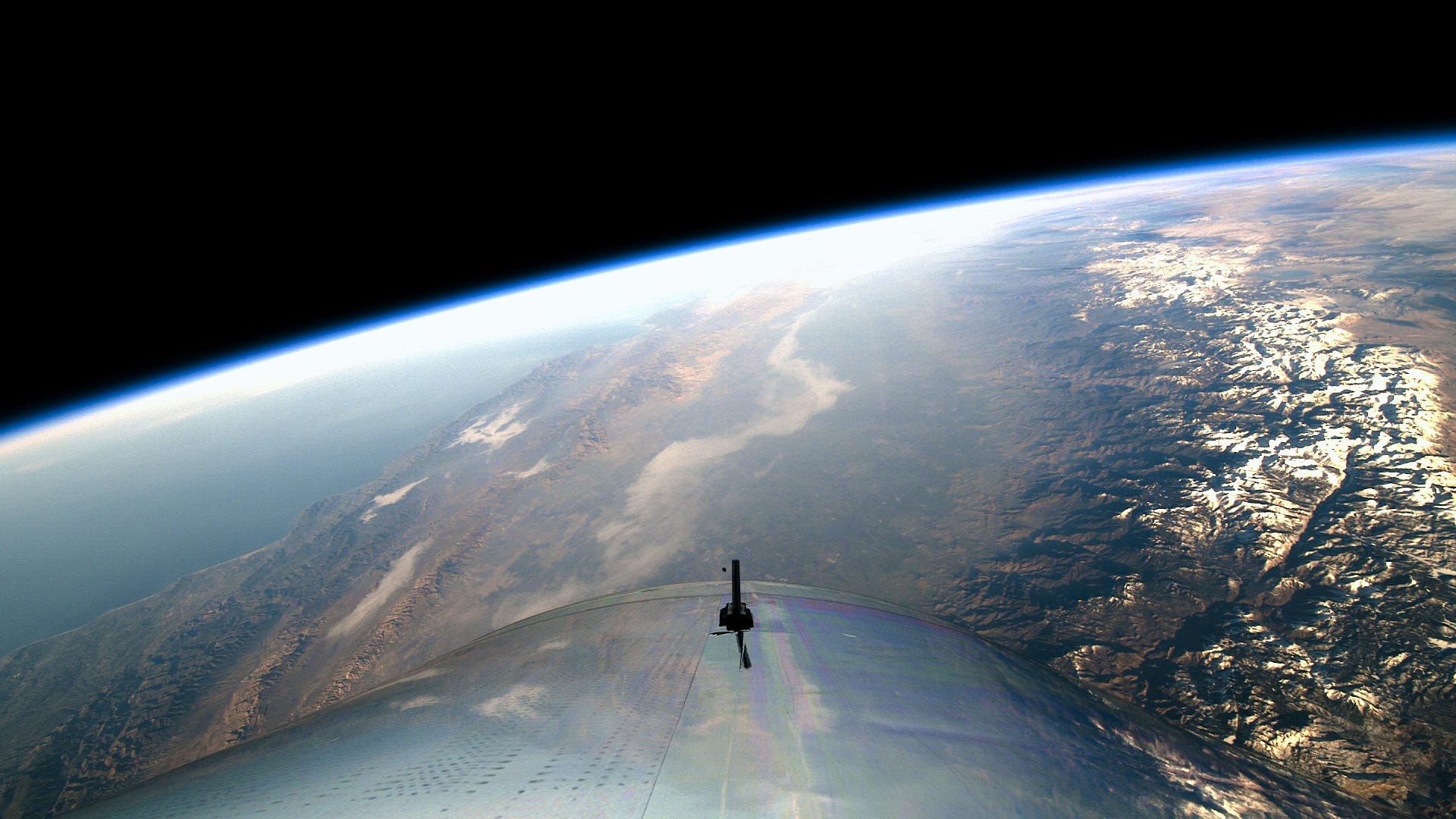 A view of Earth's surface and curvature from space aboard Virgin Galactic's vehicle.