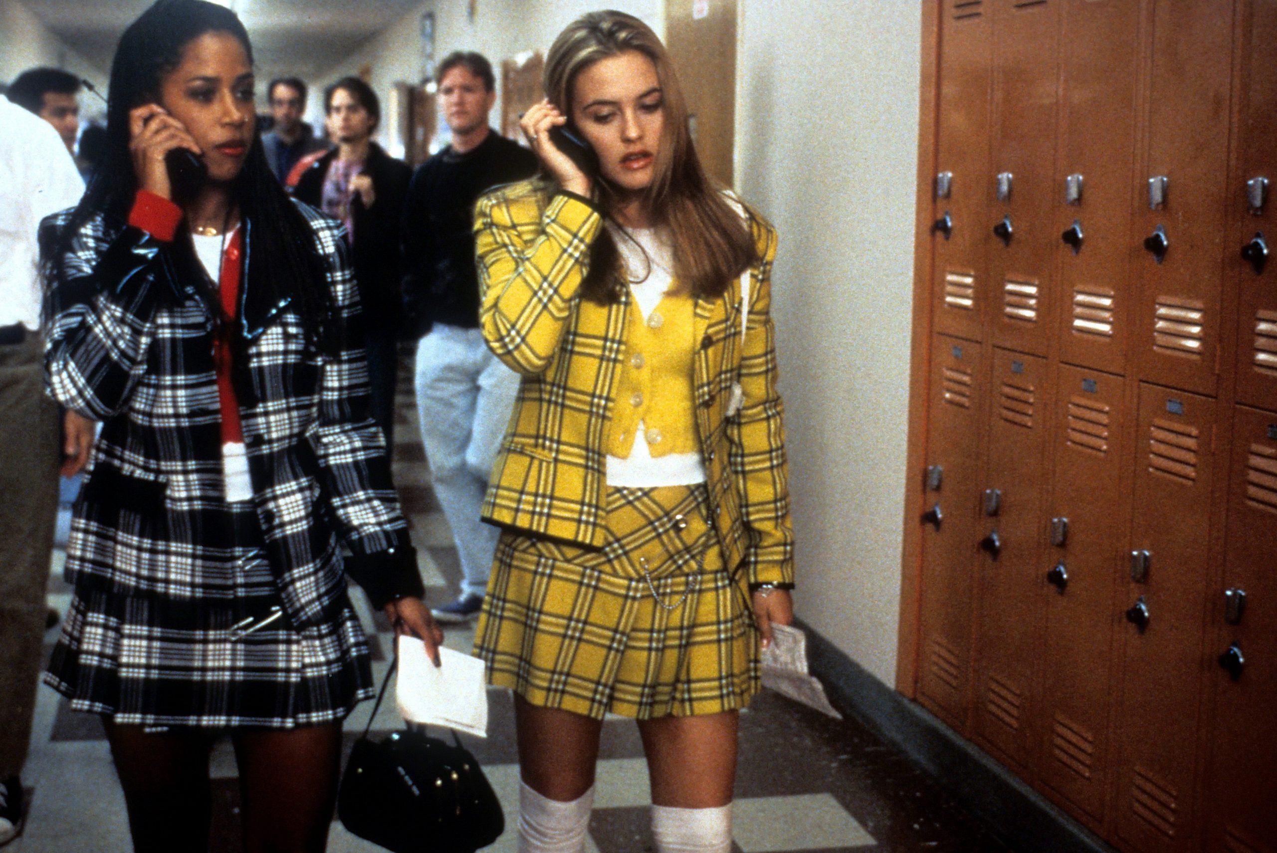 Alicia Silverstone wearing her iconic yellow tartan outfit in the movie "Clueless"
