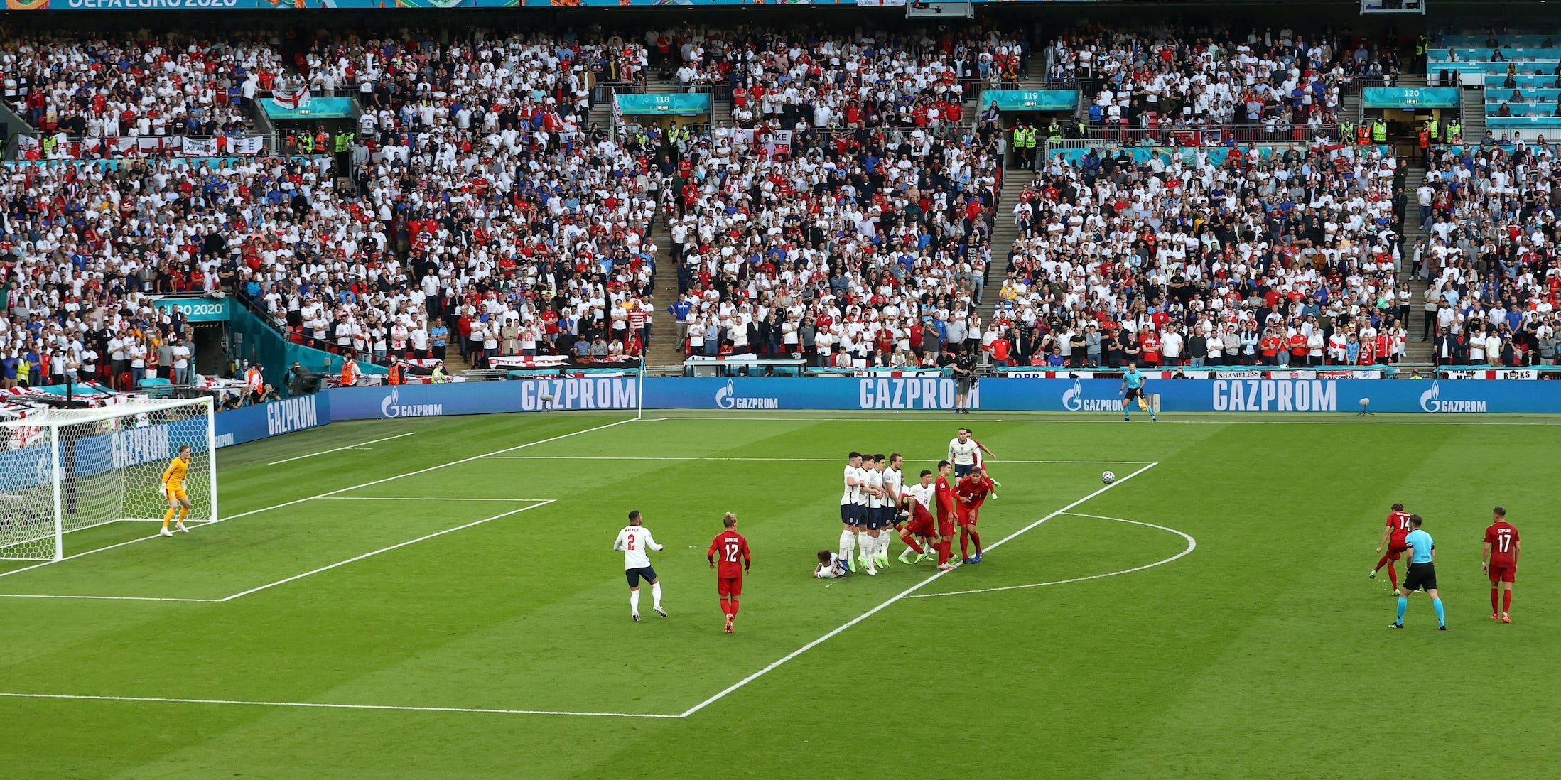 Mikkel Damsgaard of Denmark scores their team's first goal from a free kick in the Euro 2020 semifinal.