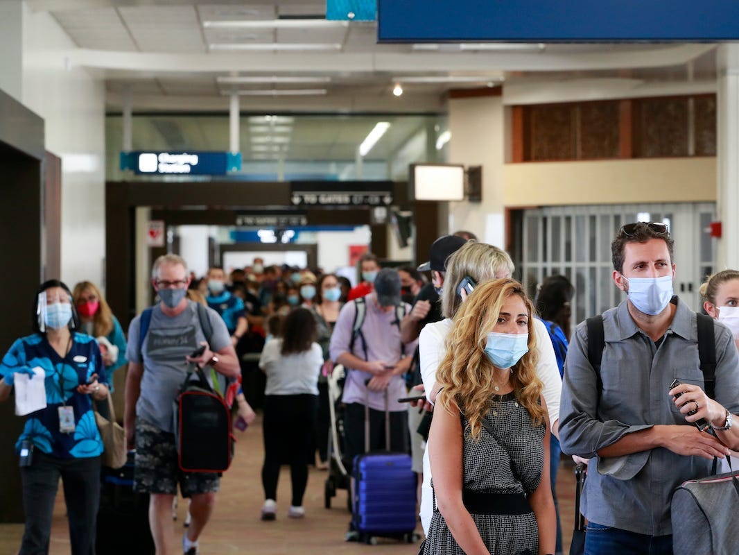 Visitors at the Daniel K. Inouye International Airport in Honolulu, Hawaii, enter the state after the new pre-travel testing program launched.