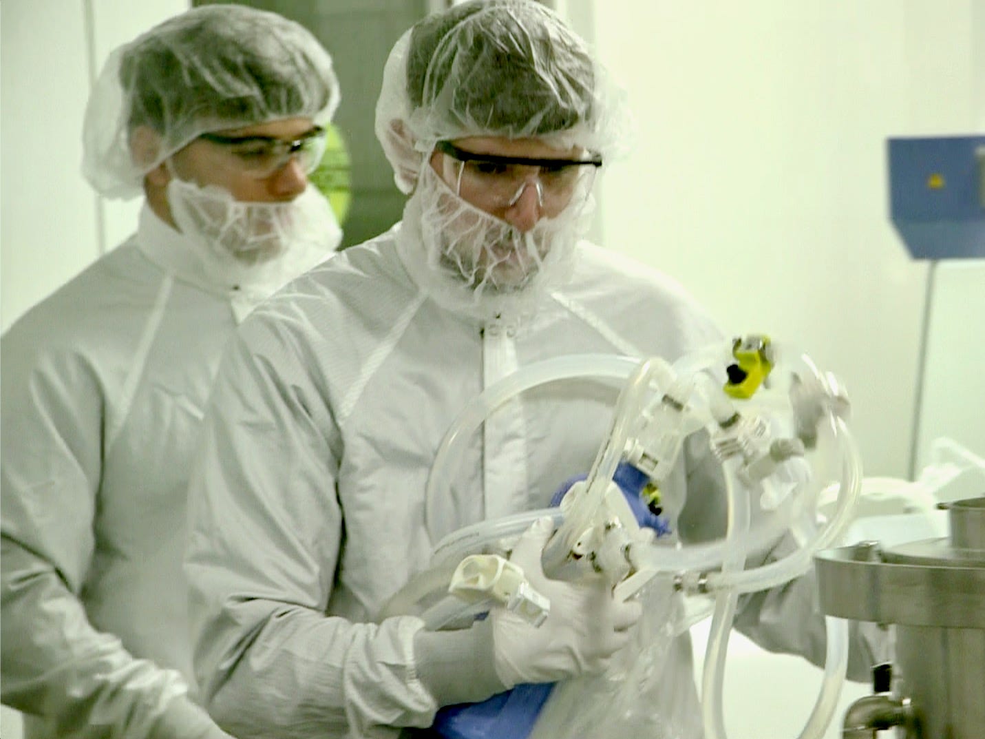 Two researchers work inside a lab at the biotech company Moderna.