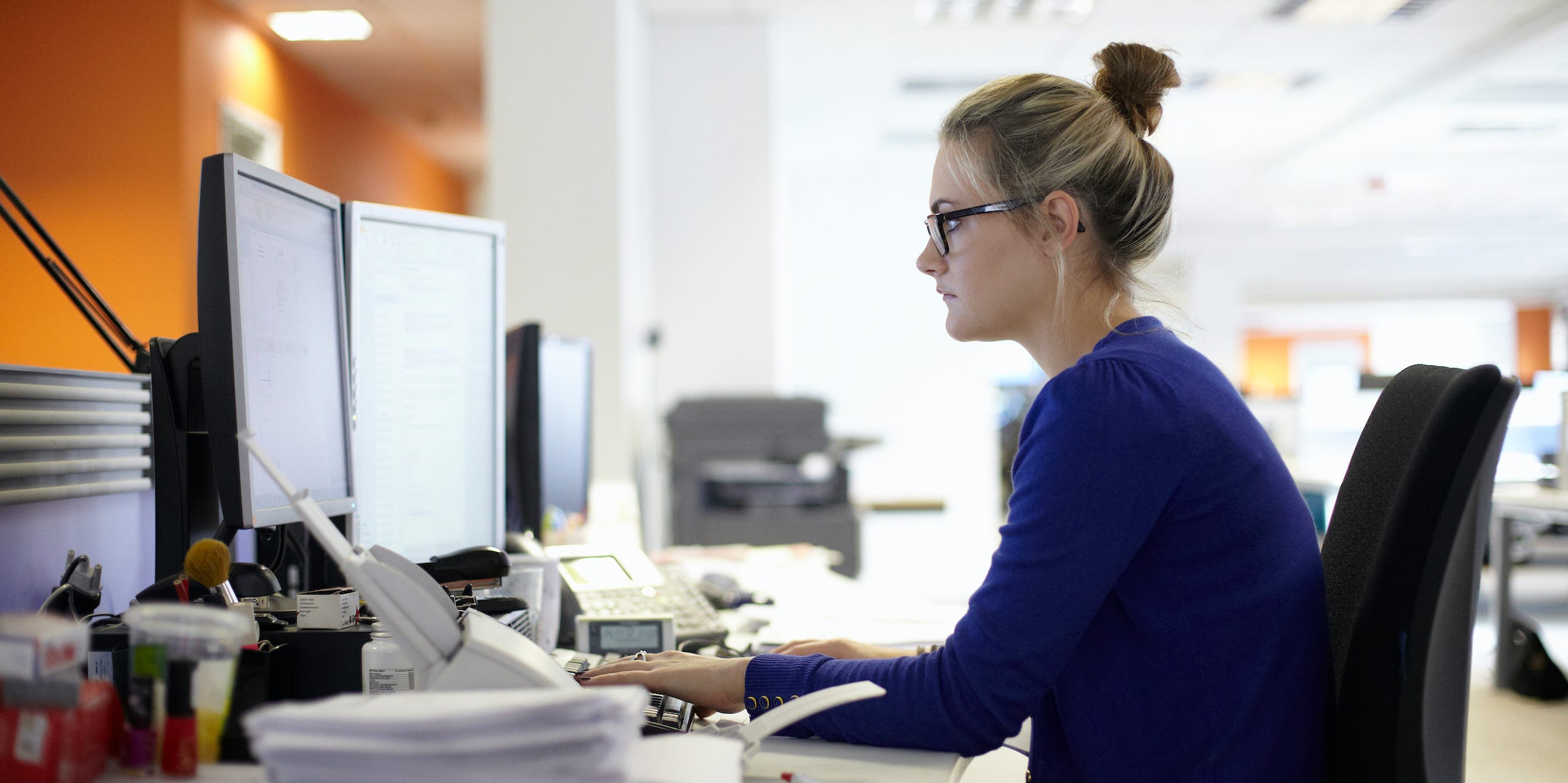 businesswoman using desktop PC computer at office