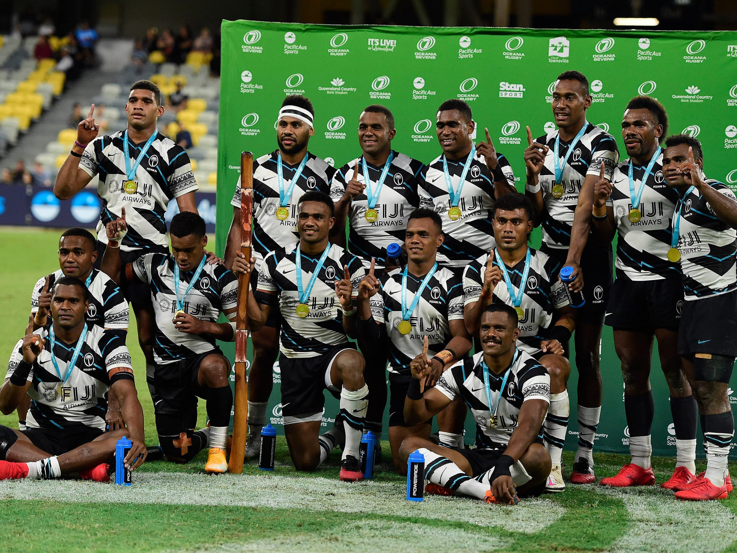 The Fiji team pose for a photo after winning the Oceania Sevens Challenge at Queensland Country Bank Stadium on June 27, 2021 in Townsville, Australia.