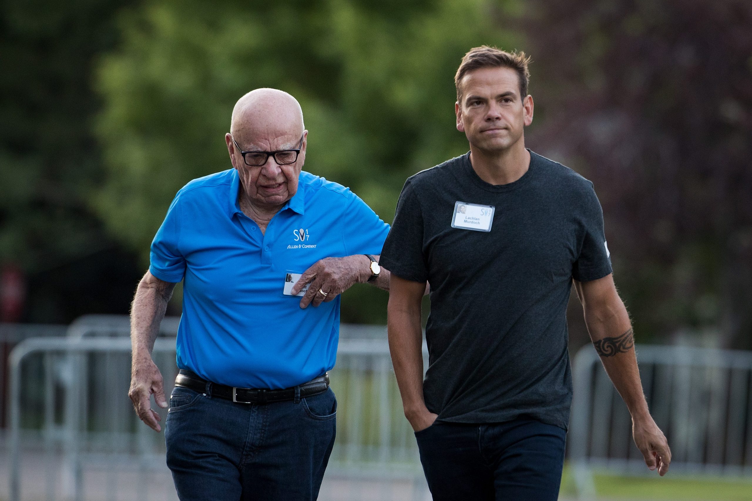 Rupert Murdoch walking next to his eldest son Lachlan Murdoch