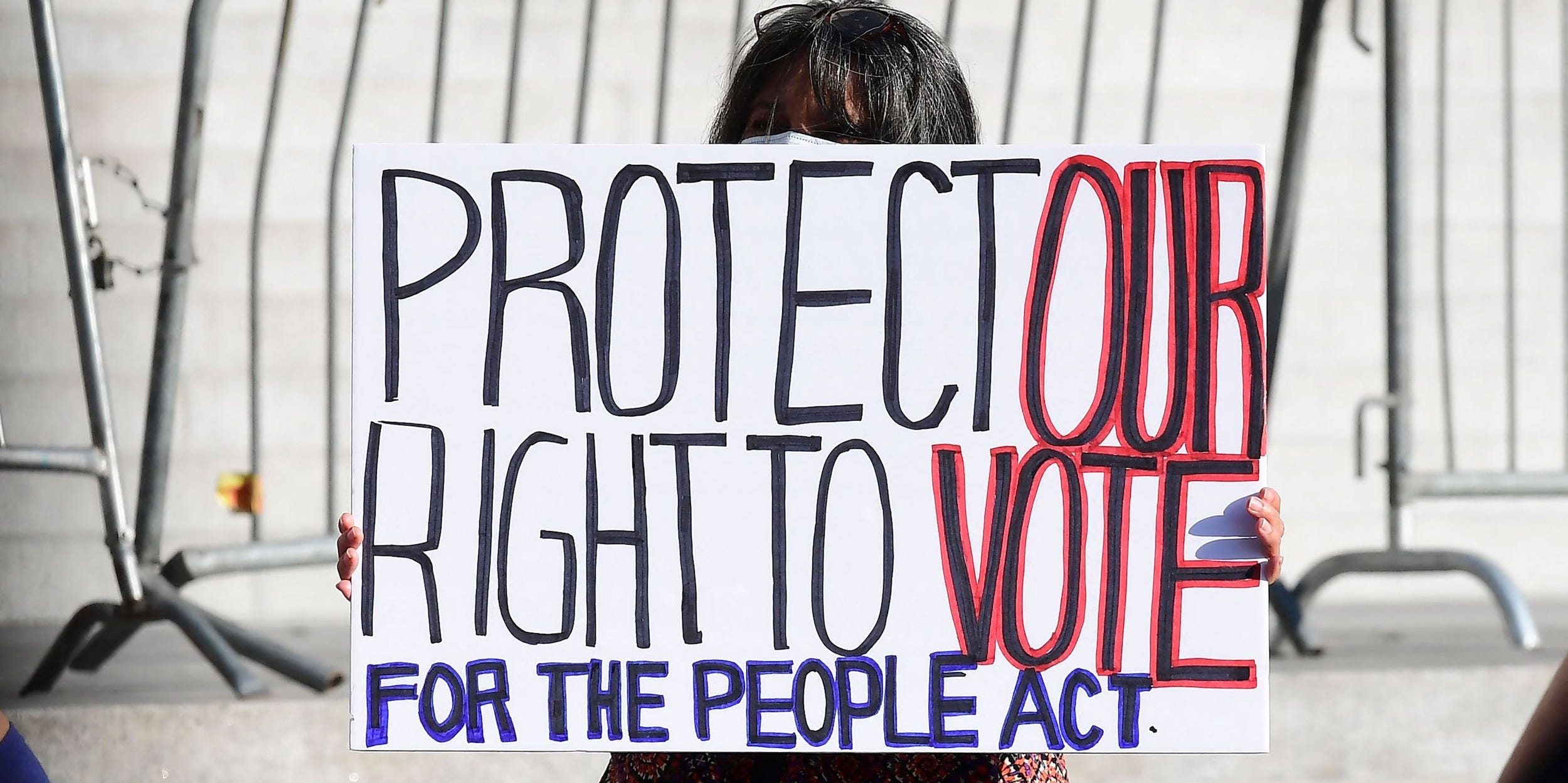 voting rights protestor with sign