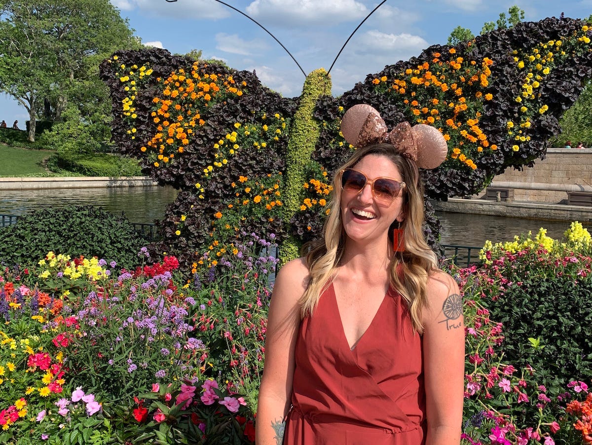 Writer Tarah Chieffi poses for a photo wearing Minnie ears at Disney World, Florida.