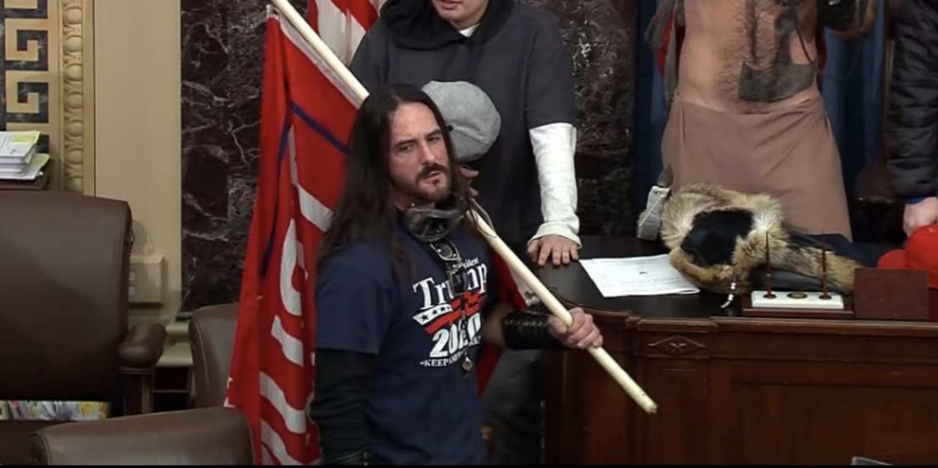 Paul Hodgkins in the Capitol with a Trump flag on January 6.