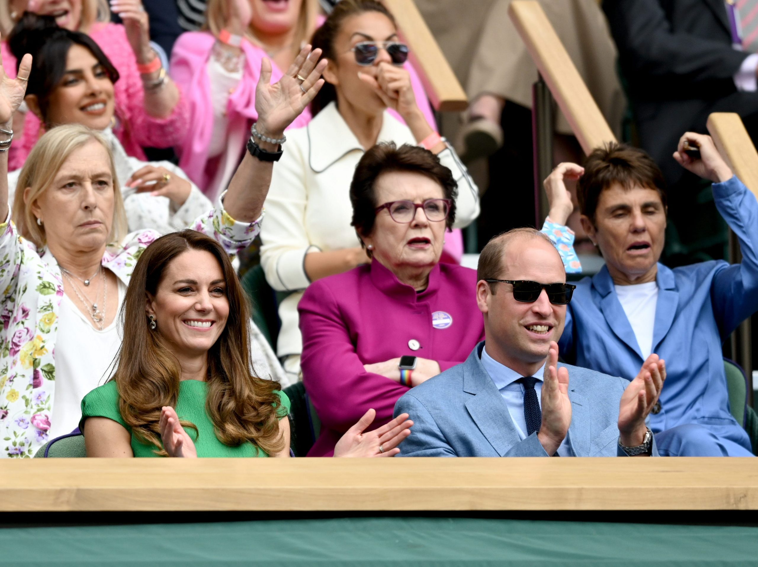 Kate Middleton wears a green dress as she sits next to Prince William at Wimbledon.