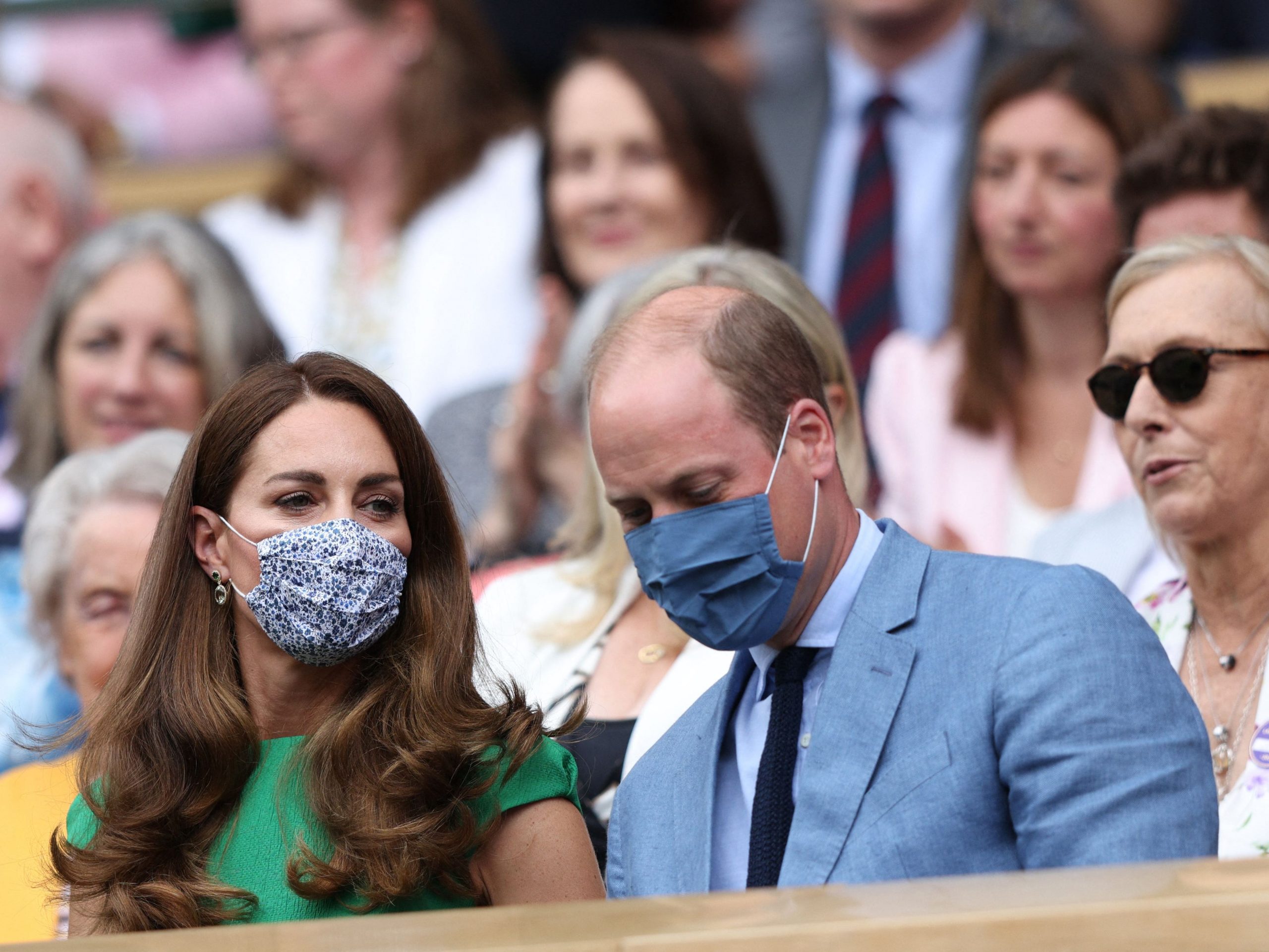 Kate Middleton and Prince William wear masks as they watch the women's final at Wimbledon.