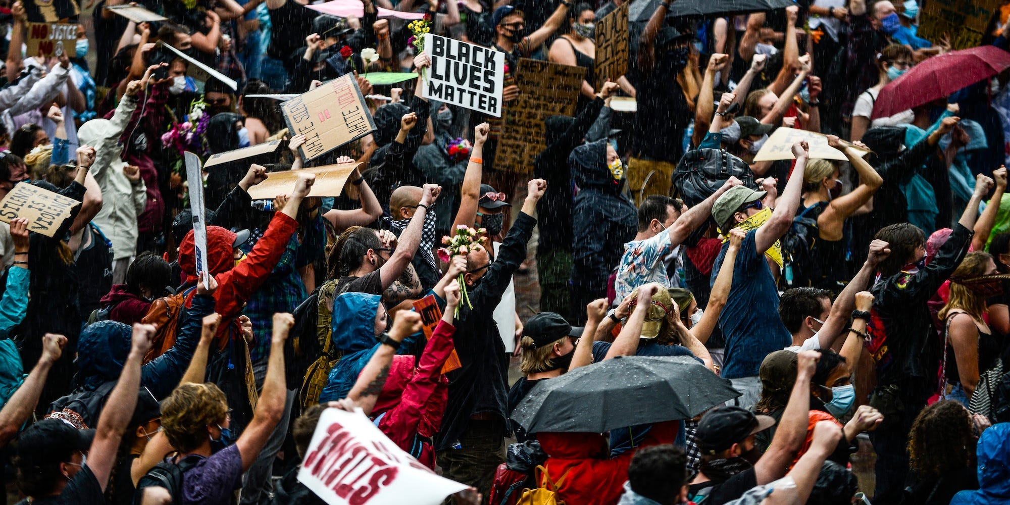 People protest as a storm rolls in on June 6, 2020 in Denver, Colorado.