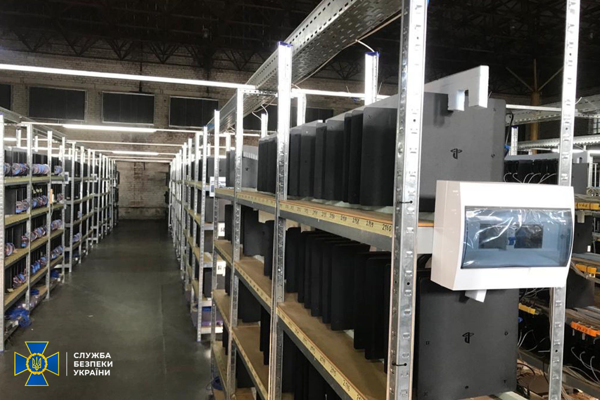 Metal racks with Sony Playstation consoles in a Ukraine crypto mine
