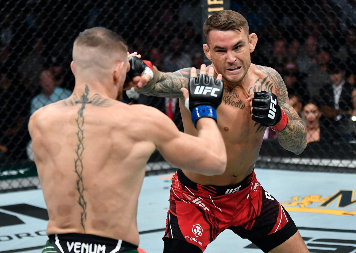 Dustin Poirier strikes Conor McGregor en route to his first-round finish.