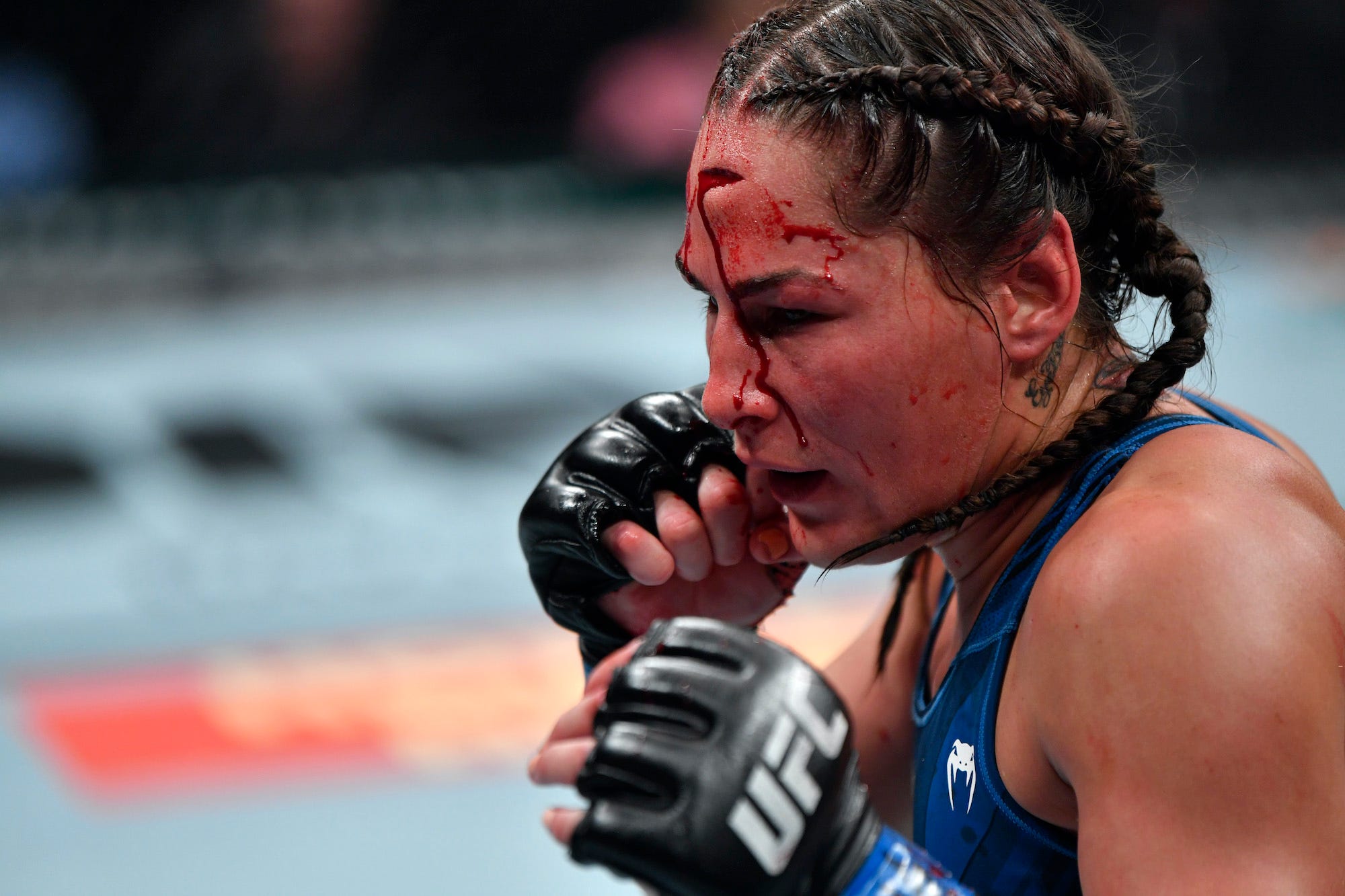 Jessica Eye's head wound weeps during her UFC match.