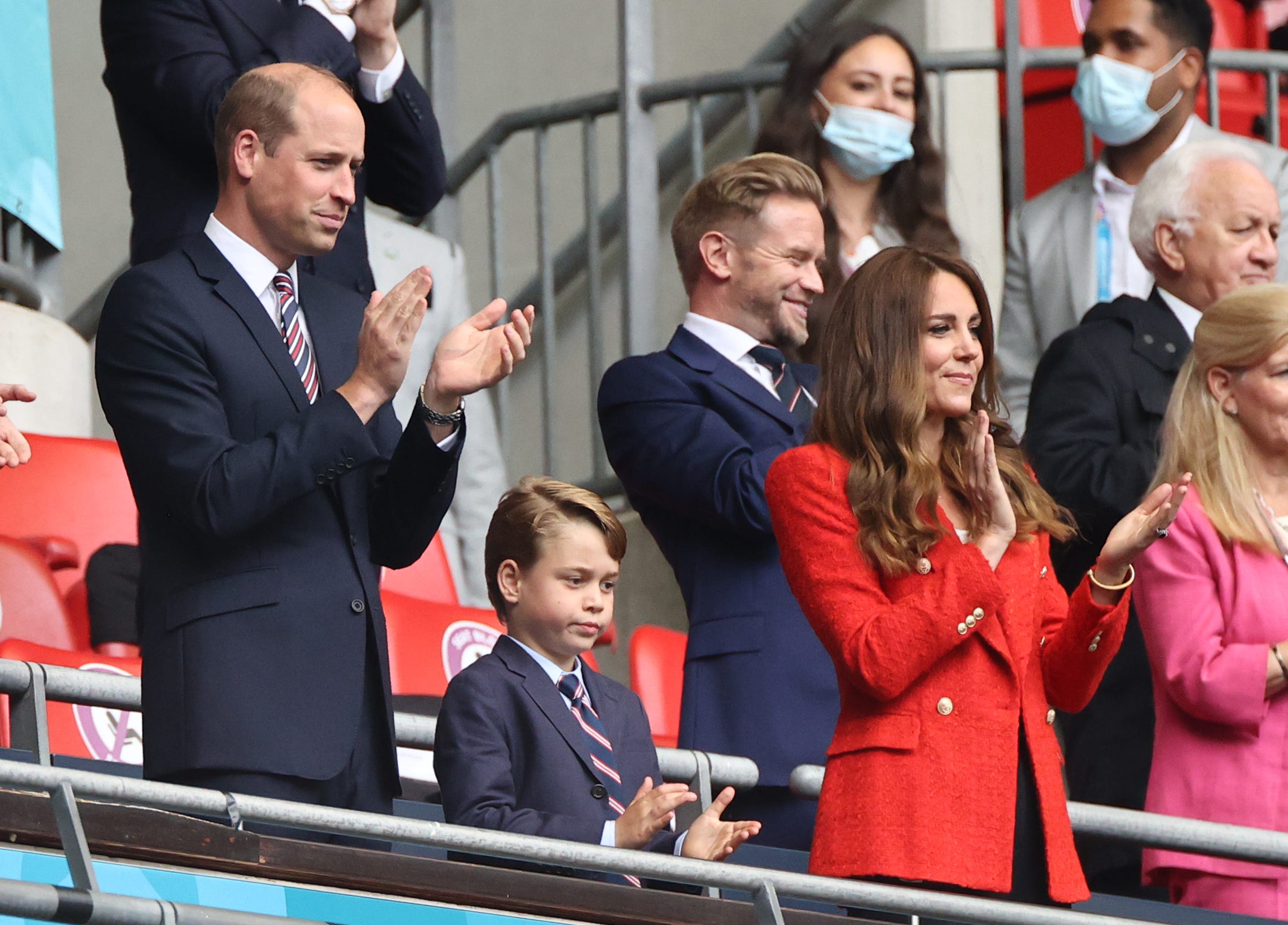 Prince William and his son Prince George wear matching suits at the Euro soccer match between England and Germany.