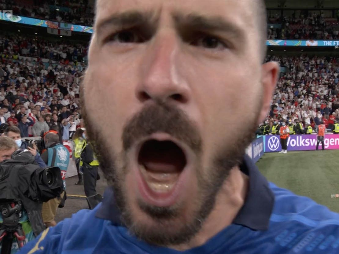 Italy's Leonardo Bonucci screams "it's coming Rome" at a camera after winning Euro 2020