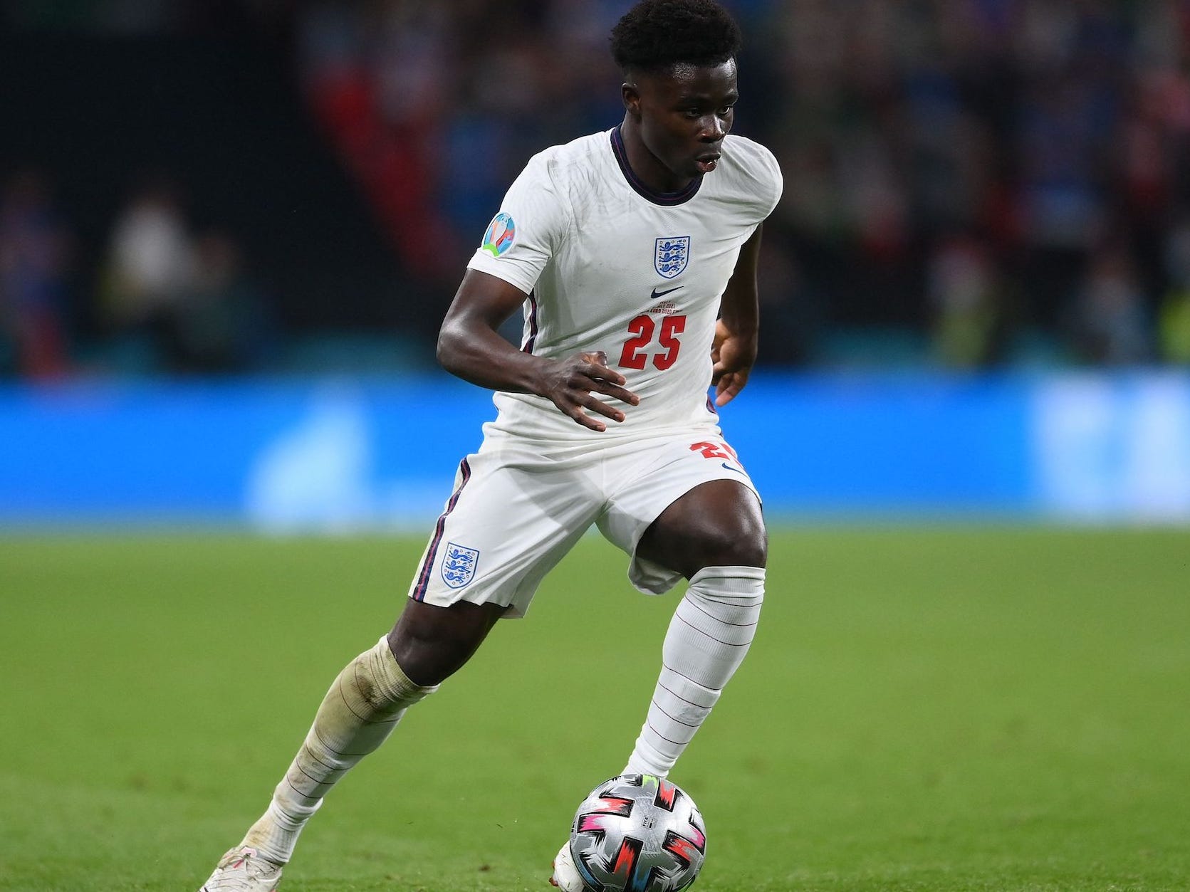 english soccer player bukayo saka is seen on a field