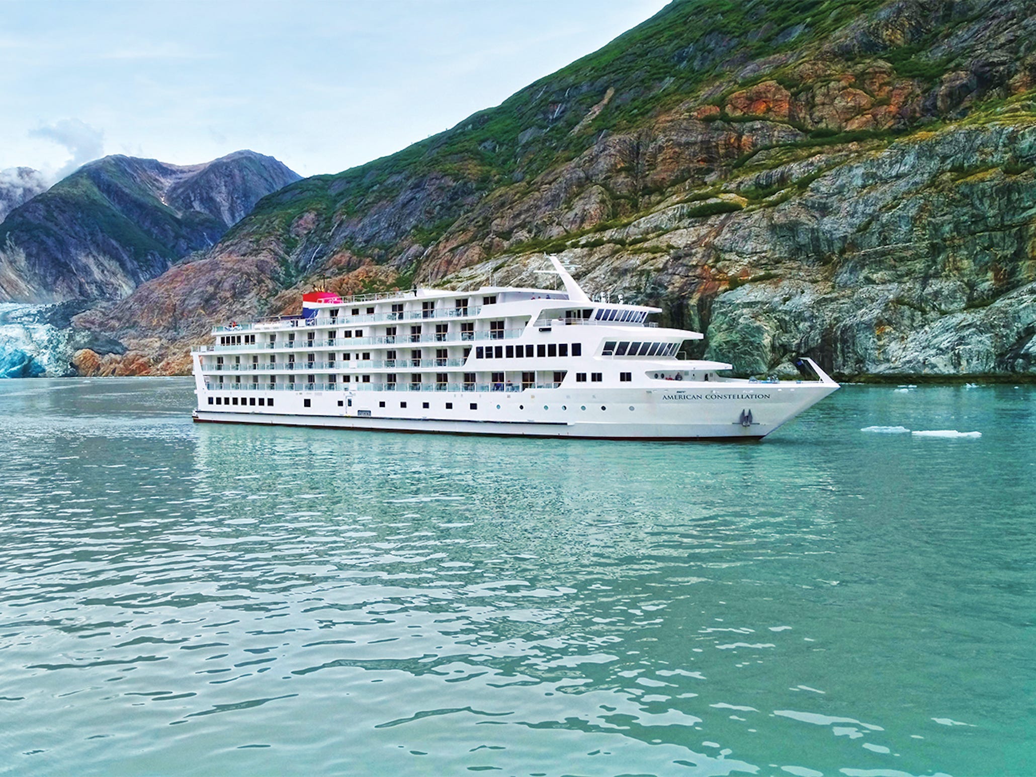 The American Constellation ship sailing in water