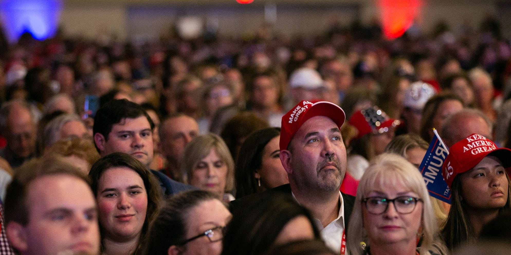 Supporters listen as former US President Donald Trump speaks at the Conservative Political Action Conference (CPAC) in Dallas, Texas on July 11, 2021.