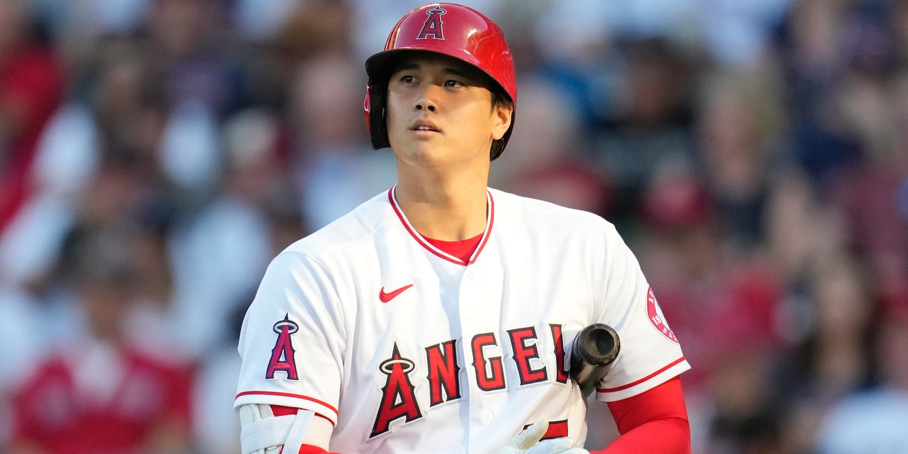 Shohei Ohtani holds his bat during a game.