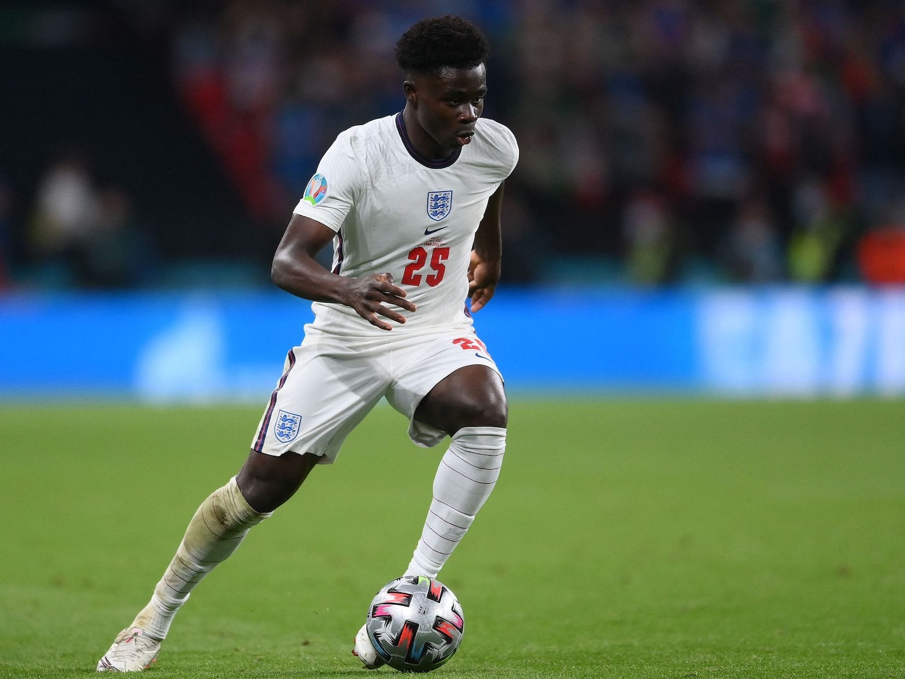 english soccer player bukayo saka is seen on a field