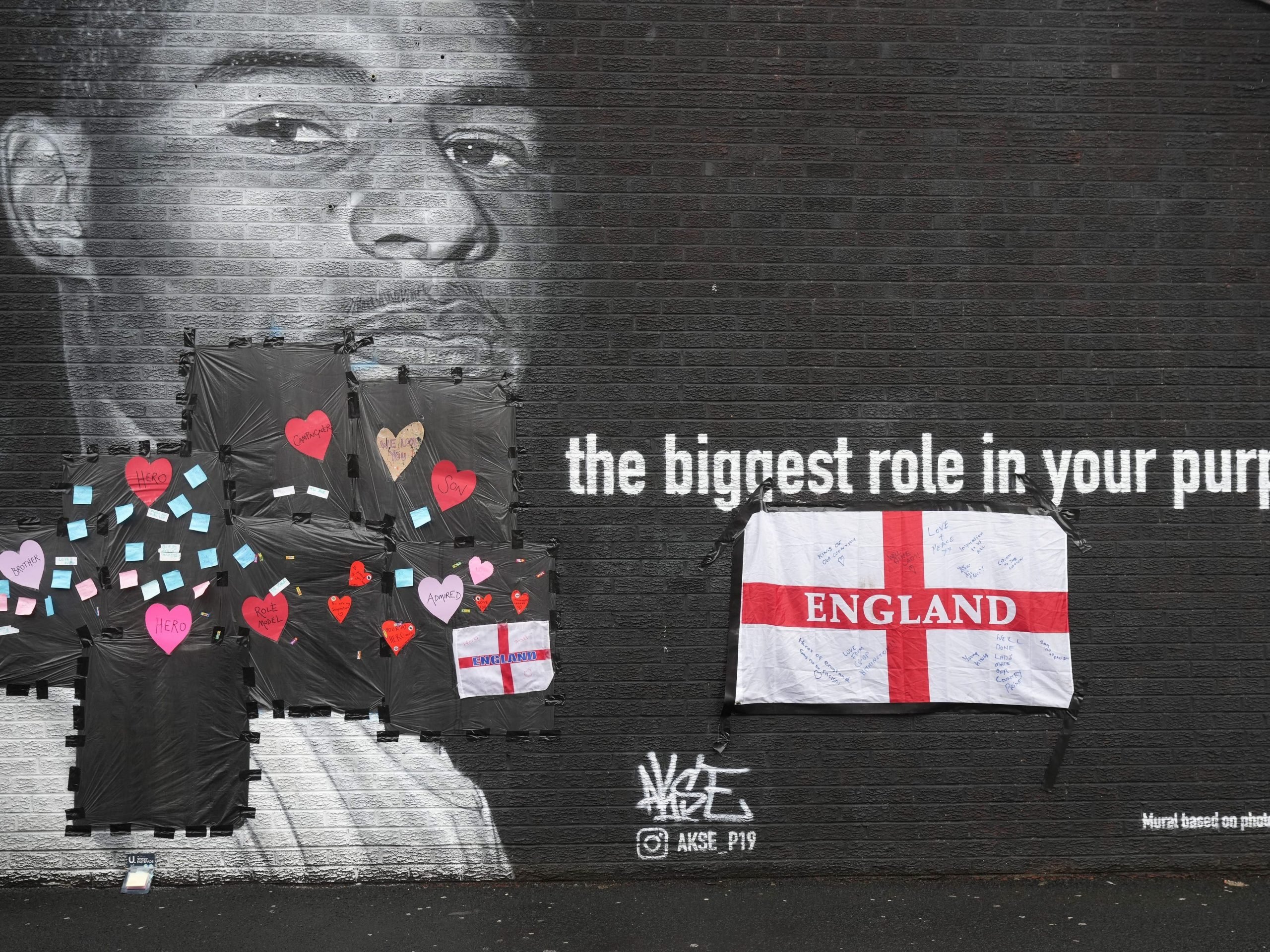 A mural dedicated to Manchester United's Marcus Rashford is covered in supportive messages after it was vandalised