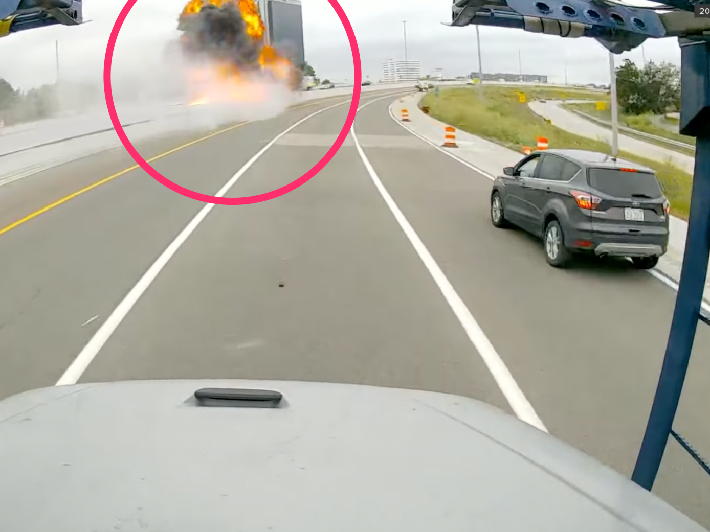 Still from a video shows a tanker truck crashing and erupting into a fireball in Michigan