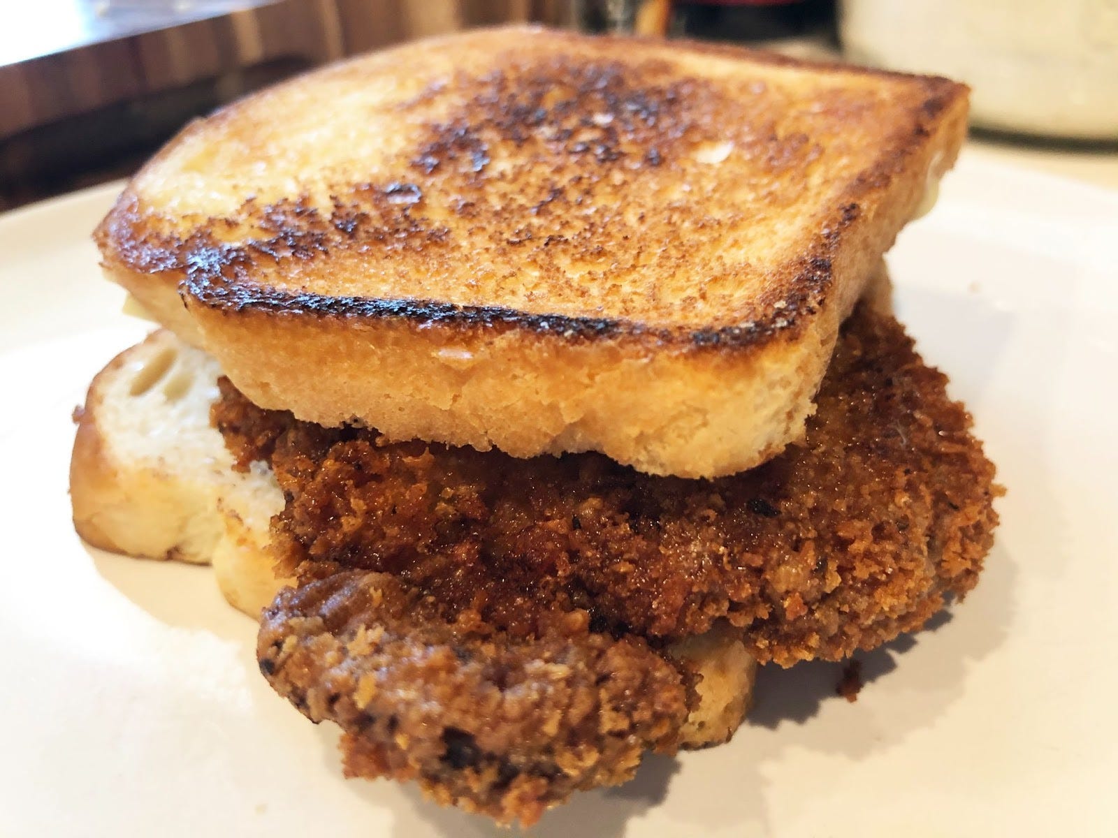 pork chop sandwich on white bread