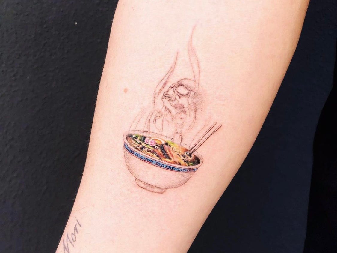 A picture of a tattoo of a colorful bowl of ramen