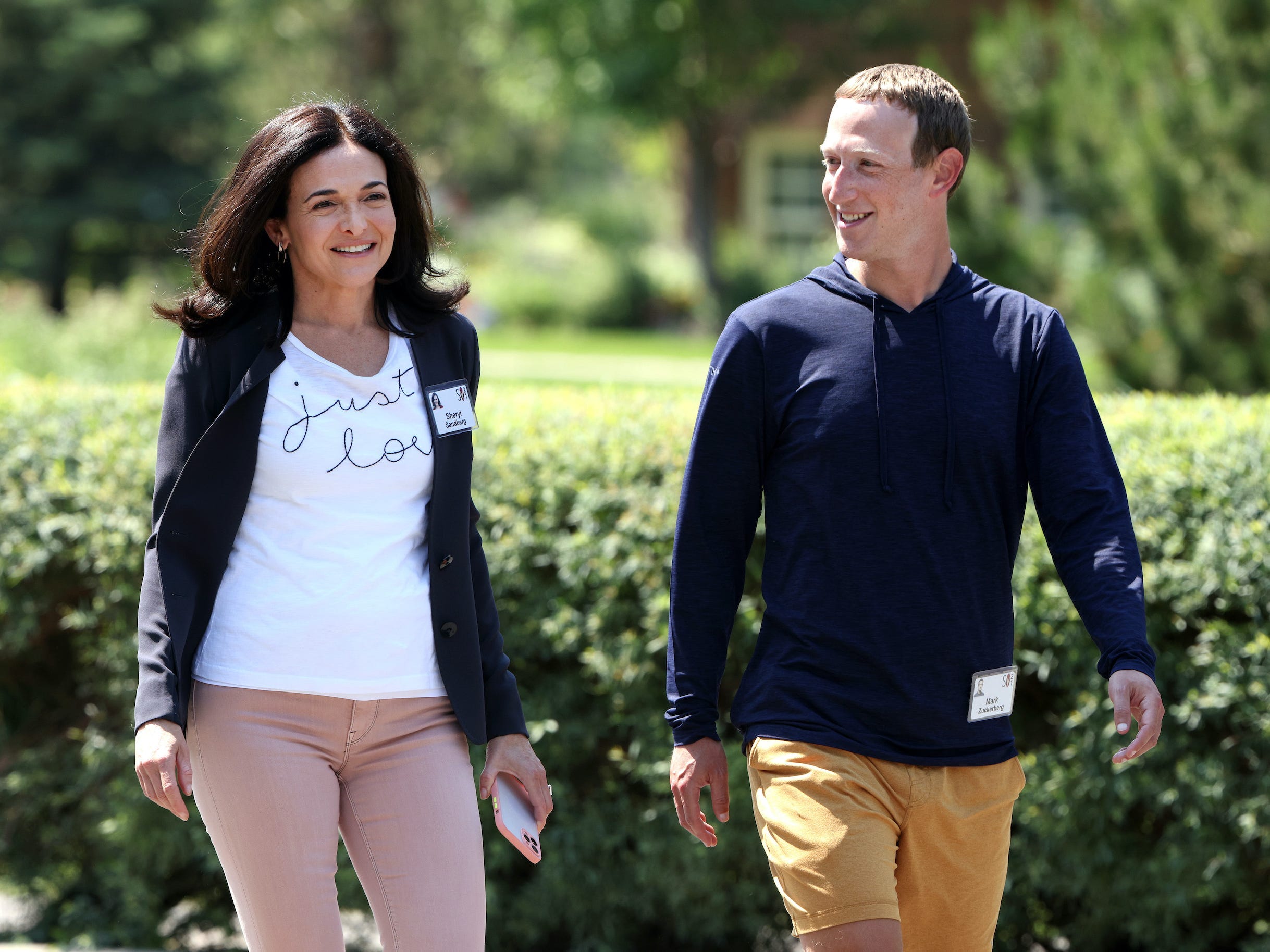 Sheryl Sandberg walks with Mark Zuckerberg at Sun Valley