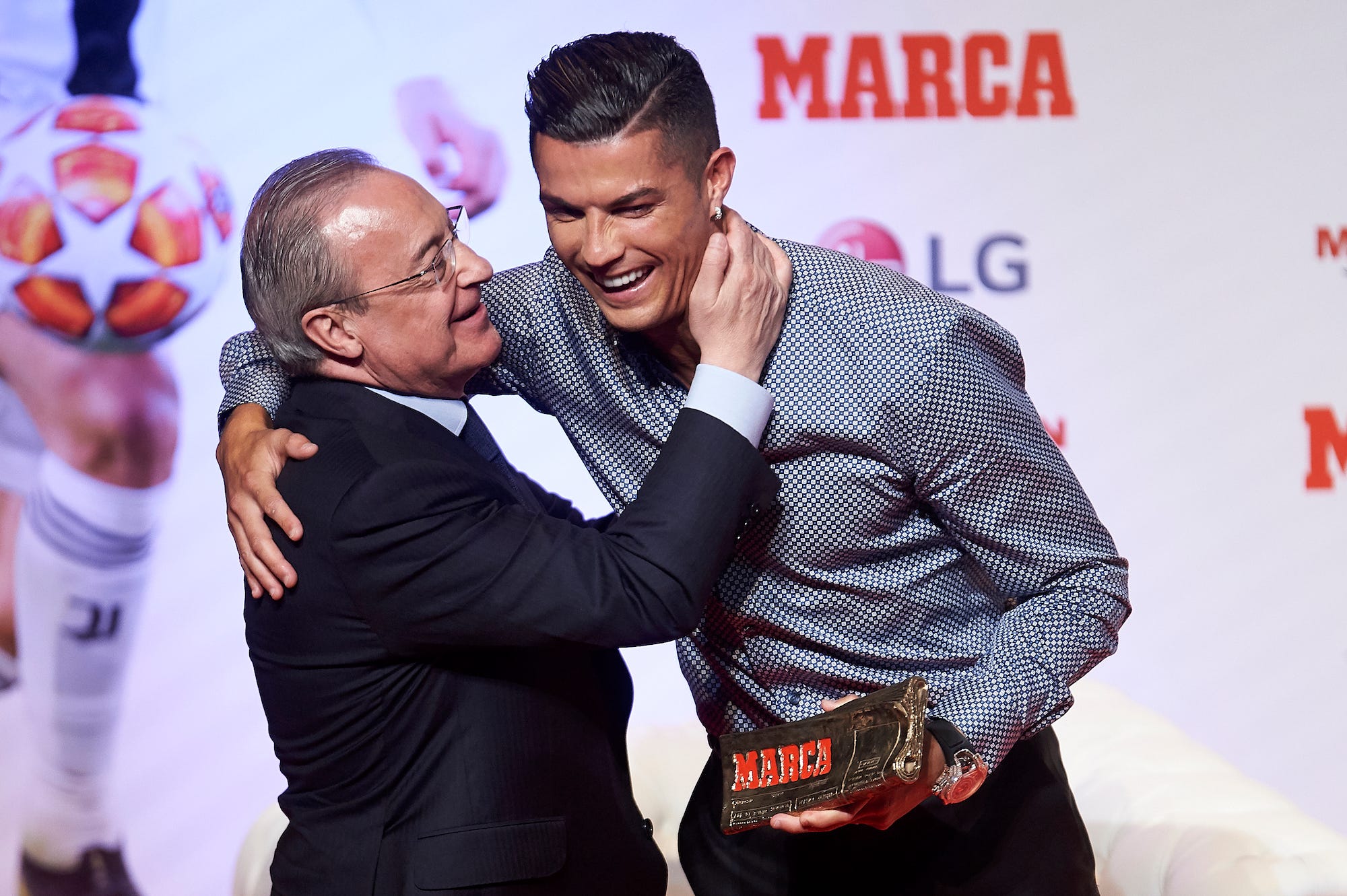 Florentino Perez presents Cristiano Ronaldo with an award in 2019