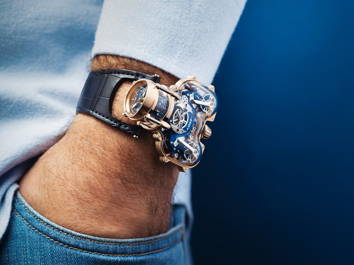 a luxury watch on a man's hand in pocket