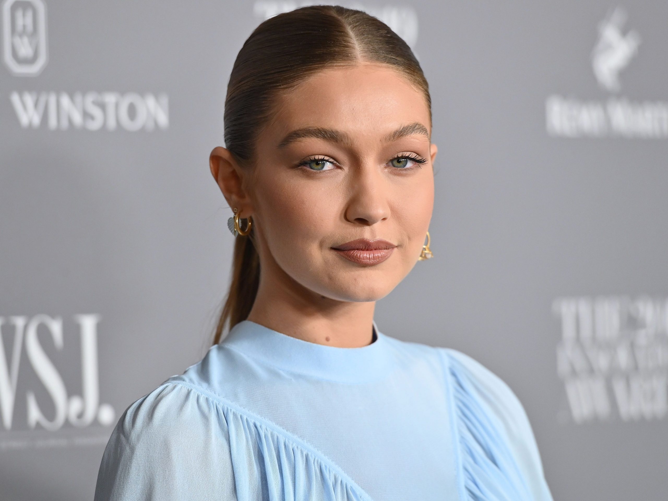 Gigi Hadid said that she voted via absentee ballot with her daughter by her side.