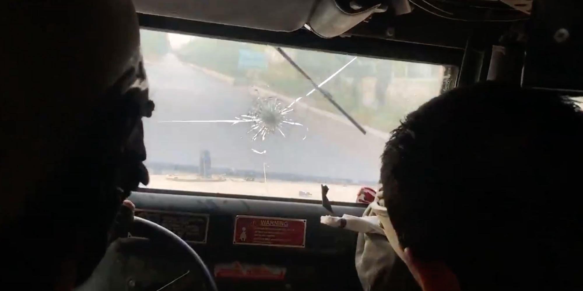 A broken windshield on the Humvee
